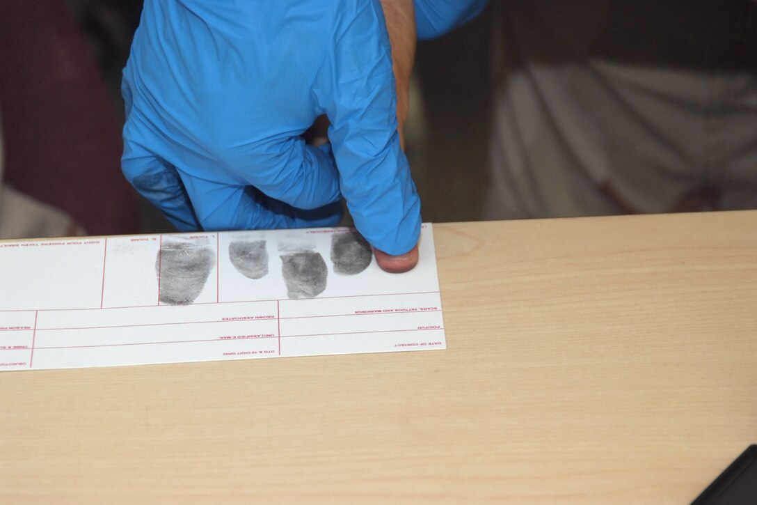 A 4th Combat Camera Airman practices fingerprinting techniques during a battlefield forensics course at March Air Reserve Base, Calif. (U.S. Air Force photo/Tech. Sgt. Joseph Zuccaro)