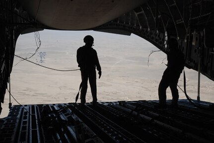 The loadmaster aboard a C-17 watches as 74,000 pounds of jet fuel descends to U.S. and coalition troops just south of Kabul as the worldwide C-17 fleet surpasses its 2 million flying hour milestone Dec. 10. In 2010 alone, C-17s and the Airmen who fly and maintain them have supported humanitarian operations in Haiti and Pakistan, a surge of 30,000 additional troops to Afghanistan, and are part of a record-breaking year for airdrops in Afghanistan. (Courtesy Photo.)