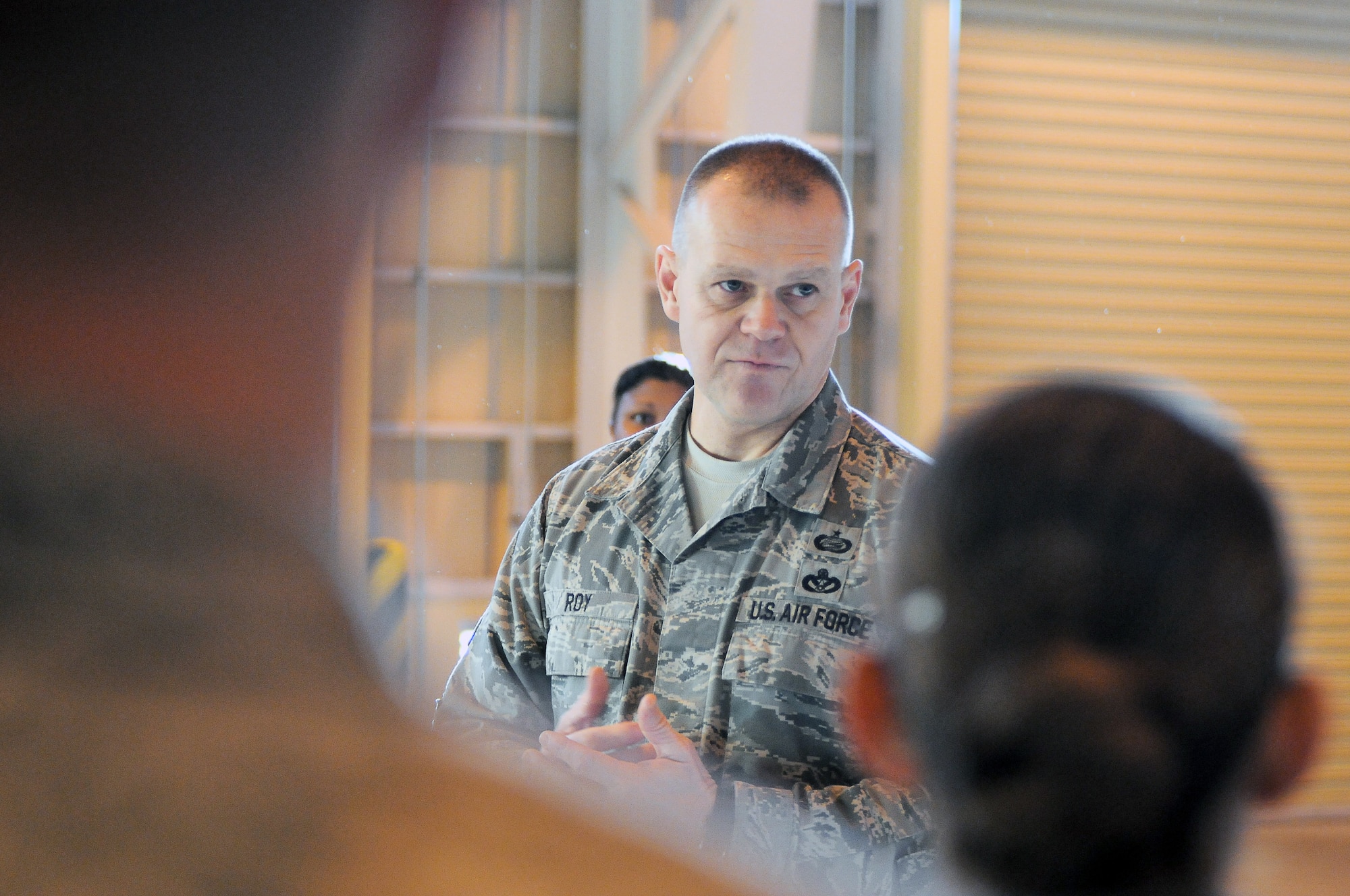 Chief Master Sgt. of the Air Force James Roy visits with members of the 374th Logistics Readiness Squadron Dec. 28, 2010, during his visit to Yokota Air Base, Japan. Chief Roy visited Yokota AFB as part of his tour of the Pacific. (U.S. Air Force photo/Airman 1st Class Katrina R. Menchaca)