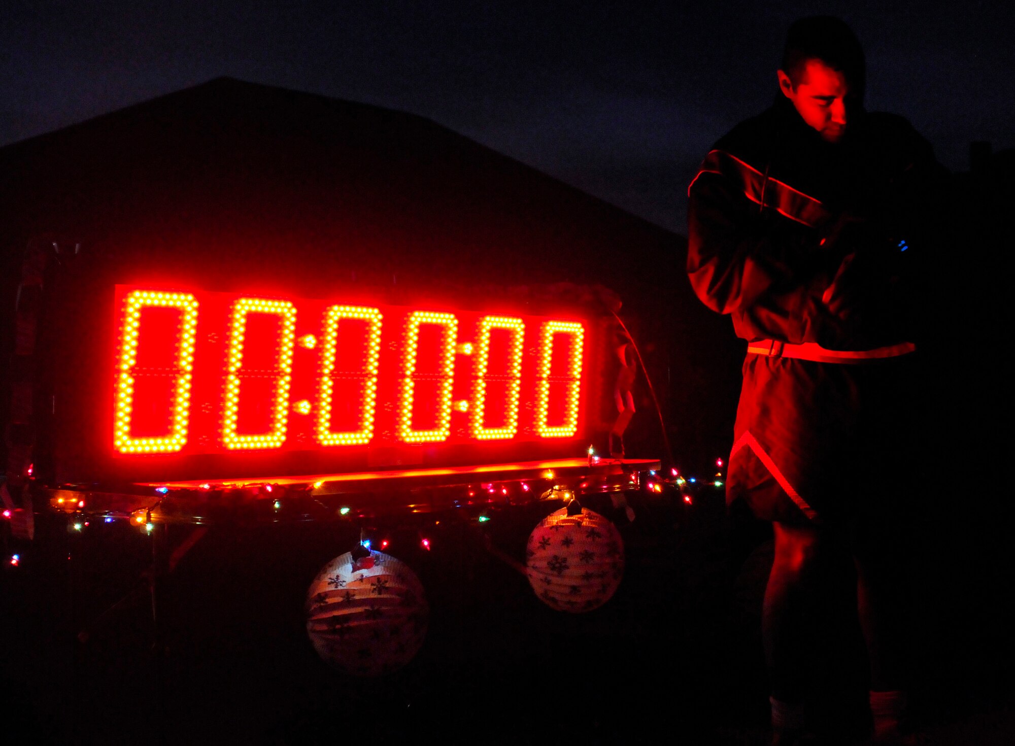 SOUTHWEST ASIA -- Master Sgt. Ed Tovar, 467th Expeditionary Logisitics Readiness Squadron, sets his watch just before the Christmas Eve 10k with the 386th Air Expeditionary Wing. The run was the final event for the wing's 12 Days of Christmas Fitness Challenge. (U.S. Air Force photo by Capt. Heath Allen)