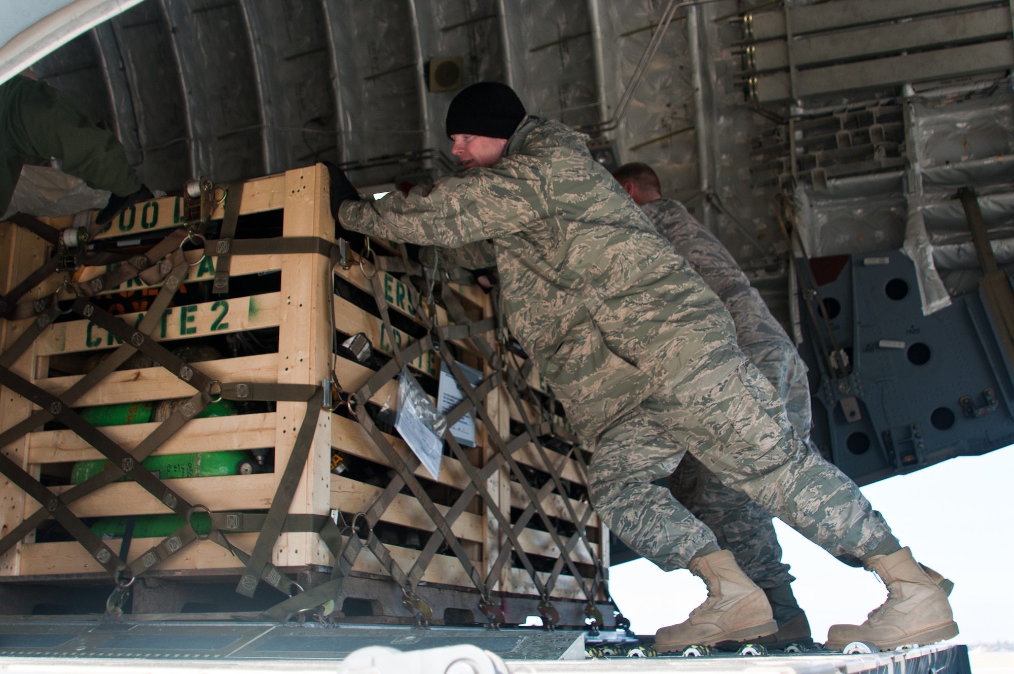 Airmen from the Air Force Reserve's 315th Airlift Wing, Charleston, S.C., load medical supplies onto a 315th AW C-17 Dec. 30, 2010, at Robins Air Force Base, Ga. The aircrew landed here to pick up humanitarian aid bound for Managua, Nicaragua. A 1984 E-One fire truck and supplies, totaling nearly 3.5 tons, was donated by Emergency Response Services for Latin America to assist countries in Latin America. (U.S. Air Force photo/Staff Sgt. Alexy Saltekoff)