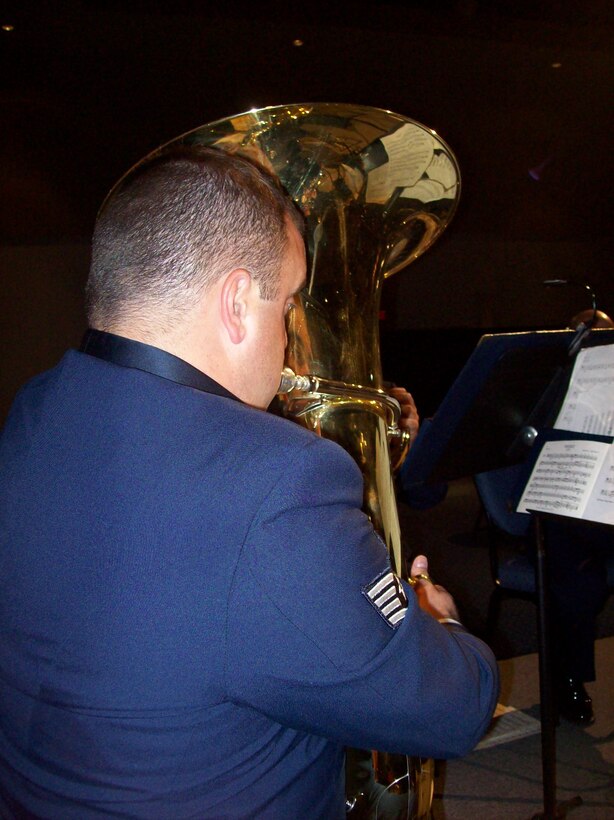 SSgt Matthew Holmberg performs with the Brass in Blue at the AFSOC Order of the Sword ceremony at the Emerald Coast Conference Center in Fort Walton Beach, Fla., Nov. 19, 2010.