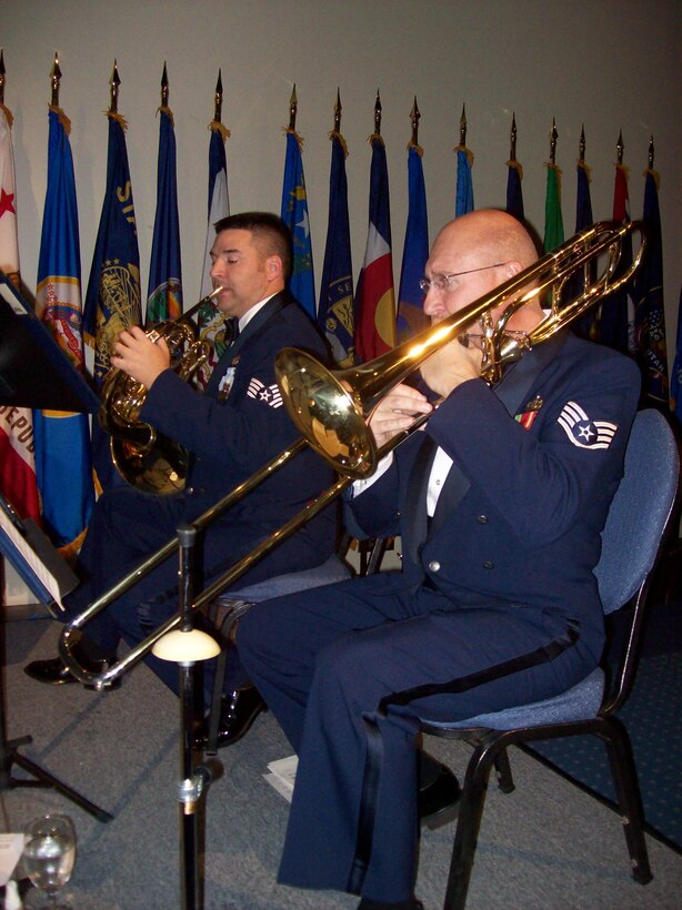 TSgt Jeremy Buss and SSgt Clay Sattazahn, NCOIC, perform with the Brass in Blue at the AFSOC Order of the Sword ceremony at the Emerald Coast Conference Center in Fort Walton Beach, Fla., Nov. 19, 2010.