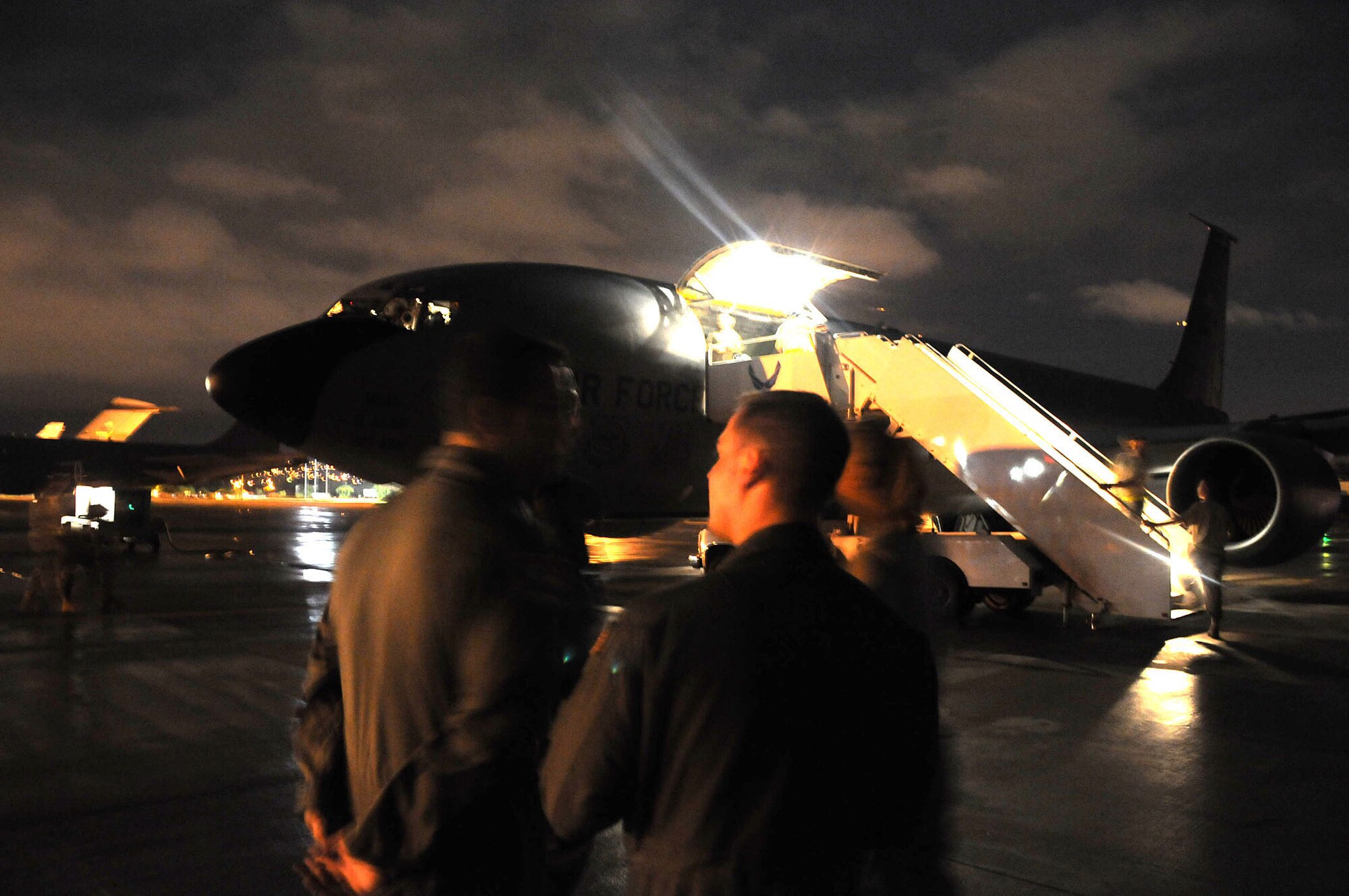 Hickam Air Force Base, Hawaii -- After a trying experience, crew members of a KC-135 Tanker gather after all their passengers are safely de-boarded.  An in-flight emergency was declared at 22,000 feet above the Pacific Ocean when smoke and fumes were detected in the cockpit. The culprit turned out to be a malfunction with the pressurization system.  (Official U.S. Air Force photo by Staff Sgt. Shawn Rhodes)