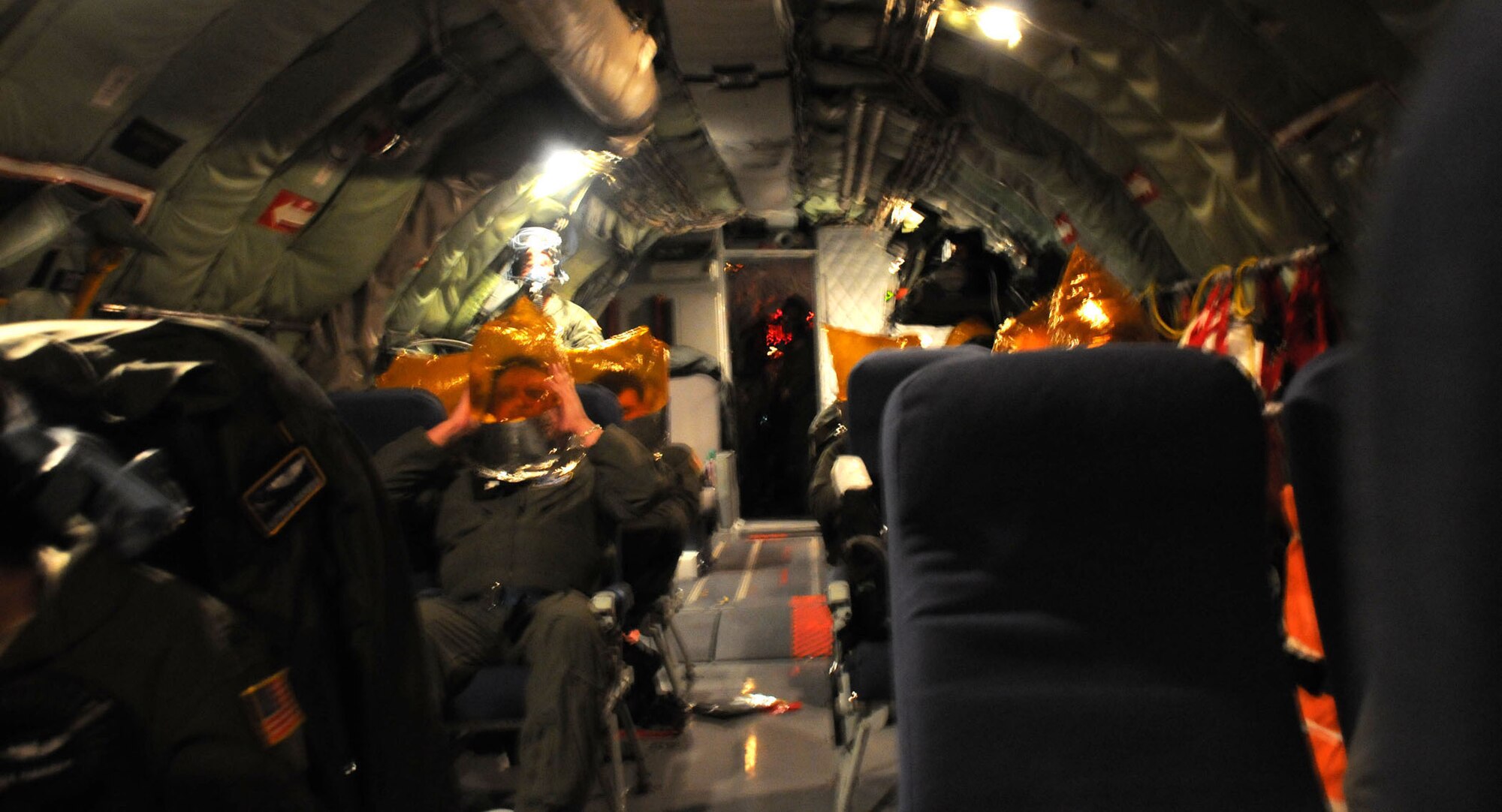 Hickam Air Force Base, Hawaii -- Twenty-four servicemembers and 10 civilians found themselves in a situation not many want to undergo - they were aboard a decades-old KC-135 Tanker when an in-flight emergency was declared 22,000 feet above the Pacific Ocean.  The smoke and fumes that caused the emergency to be declared required the passengers to don oxygen masks for their safety. (Official U.S. Air Force photo by Staff Sgt. Shawn Rhodes)