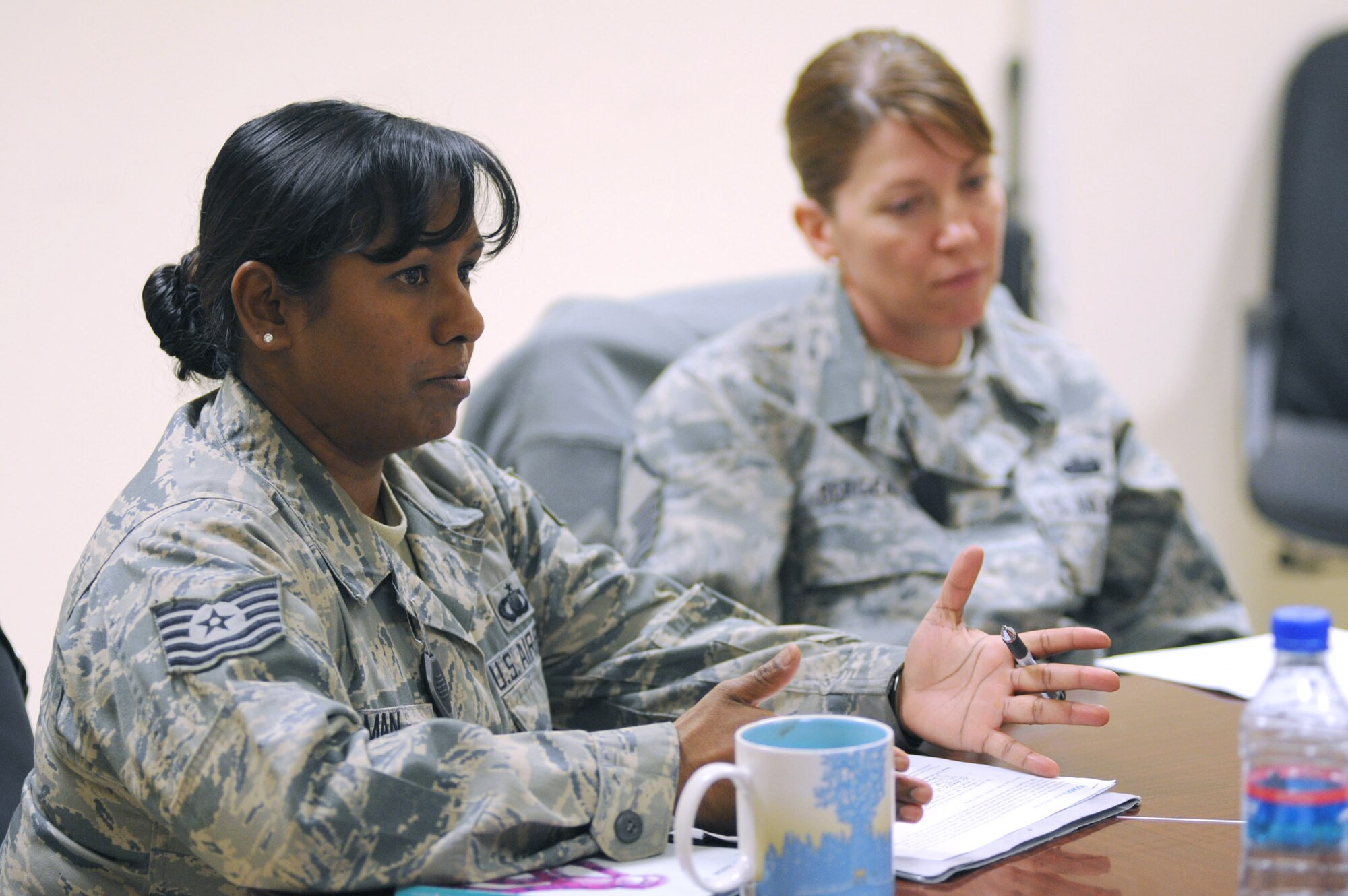 Tech. Sgt. Elizabeth R. L. Man facilitates conversation during a bible study Dec. 17, 2010, at Kandahar Airfield, Afghanistan. As a chaplain's assistant, she helps provide administrative, religious and program support for chaplains. Sergeant Man is assigned to Lackland Air Force Base, Texas, and is deployed to the 451st Air Expeditionary Wing. (U.S. Air Force photo/Tech. Sgt. Chad Chisholm)