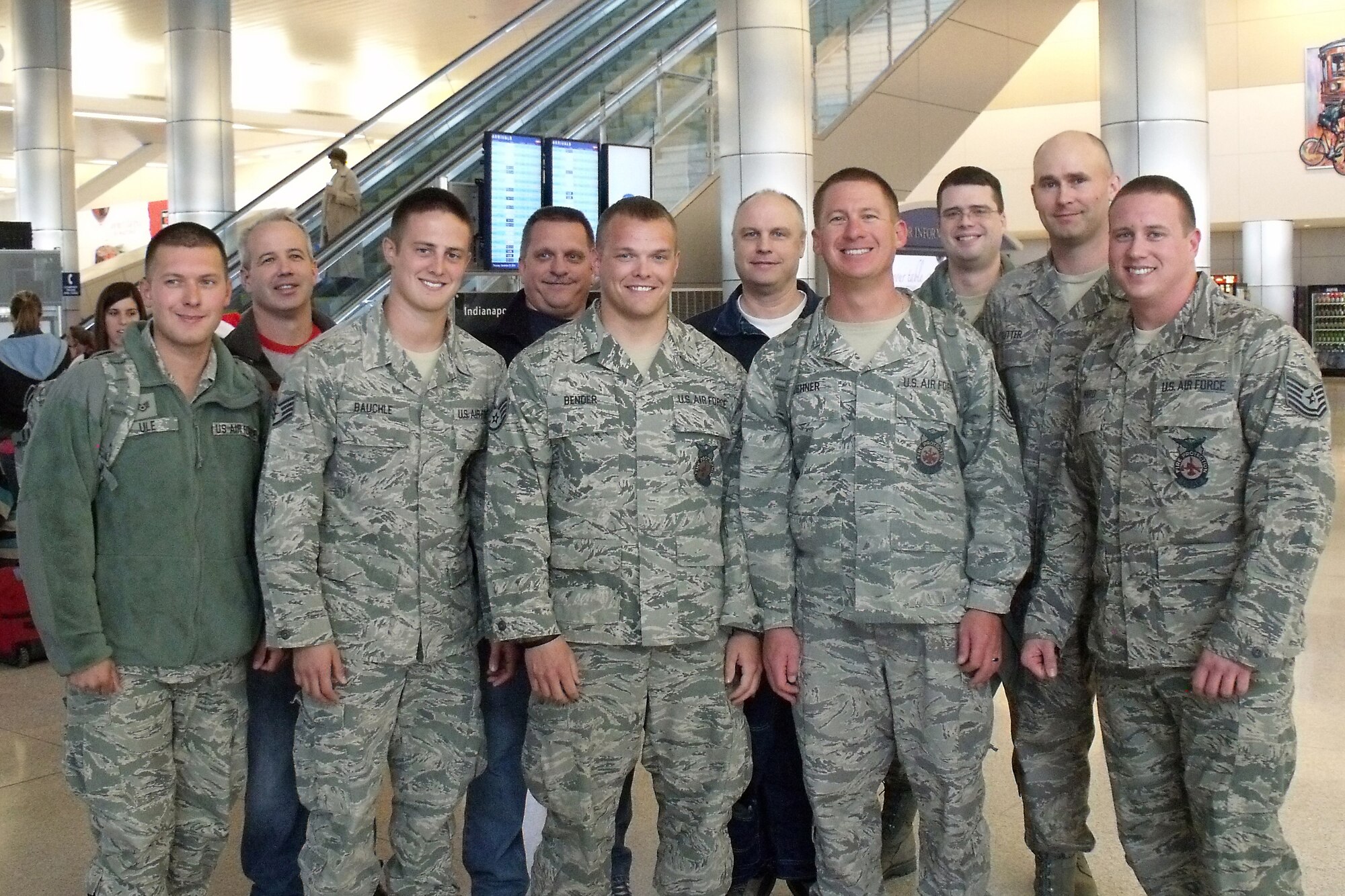 GRISSOM AIR RESERVE BASE, Ind. -- From left, Staff Sgt. Ryan Ule, Staff Sgt. Christopher Bauchle, Staff Sgt. Travis Bender, Tech. Sgt. Aaron Dehner and Tech. Sgt. Nicholas Ward pose for a photo after returning from a recent deployment to Afghanistan with Master Sgt. Kevin Wright, retired Chief Master Sgt. David Sajdyk, Master Sgt. Joseph Cougan, Tech. Sgt. Jason Finney and Tech. Jeremie Cutter behind them. The Airmen are all members of the 434th Civil Engineer Squadron fire department. (U.S. Air Force photo/Senior Airman Jamia Nalls)
