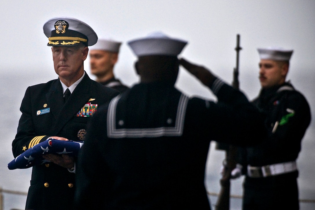 U.S. Navy Capt. Bruce H. Lindsey, commanding officer aboard the ...