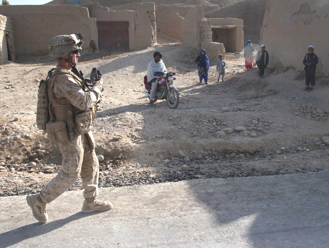 U.S. Marine Corps 1st Lt. Josef Patterson, 3rd Platoon, platoon commander, with India Company, 3rd Battalion, 5th Marine Regiment, patrols down Route 611 in Sangin District, Dec. 30. “We are here to let the local people know that they are not forgotten and that we are there with the ANA to support them in security and assist them with getting rid of improvised explosive devices and the Taliban,” said the 31-year-old native of Owasso, Okla.