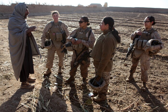 U.S. Marines assigned to a female engagement team (FET) speak with a local Afghan man in his compound during a patrol in Marjah, Helmand province, Afghanistan, Dec. 30, 2010. The FET worked with infantry Marines by engaging women and children in support of the International Security Assistance Force. (U.S. Marine Corps photo by Cpl. Marionne T. Mangrum/Released)