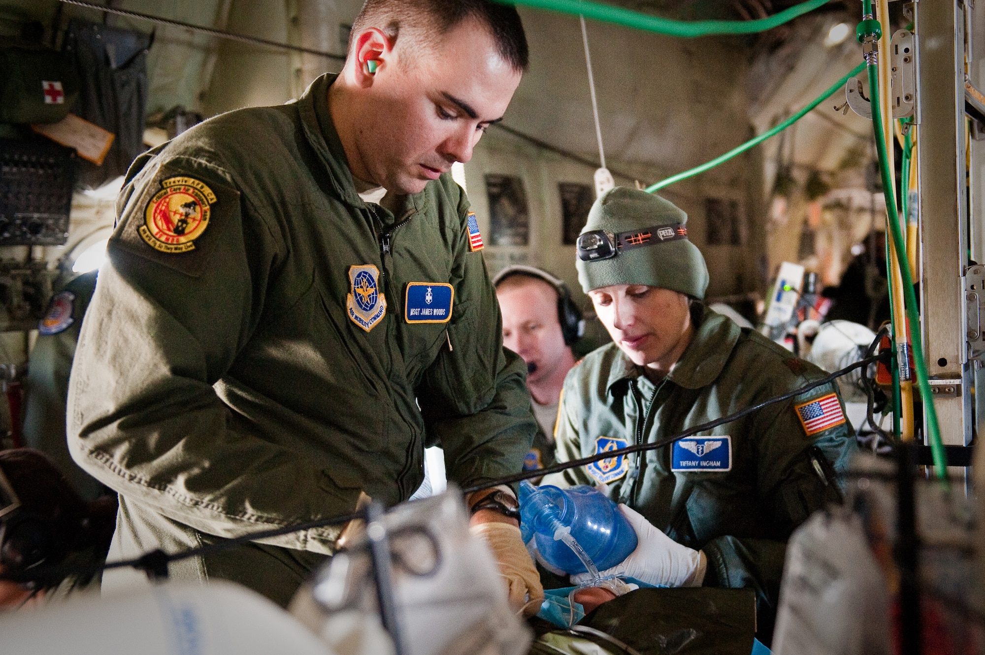 CINCINNATI, OHIO -- Master Sgt. James Woods (left), a respiratory therapist from the 60th Surgical Operations Squadron at Travis Air Force Base, Calif., and Maj. Tiffany Ingham, an anesthesiologist from the 920th Aeromedical Staging Squadron at Patrick Air Force Base, Fla., perform cardio-pulmonary resuscitation on a medical-training mannequin Feb. 11, 2010, while flying over southern Ohio aboard a Kentucky Air National Guard C-130. The Airmen were participating in a two-week Critical Care Air Transport Team course designed to provide medical personnel with total immersion in the care of severely injured patients. Ground training and simulated-flight training are conducted at the University of Cincinnati, one of four Air Force Centers for Sustainment of Trauma and Readiness Skills (CSTARS) nationwide, but the final day of instruction is provided during actual flight. The Kentucky Air Guard's 165th Airlift Squadron began providing its C-130s to use as a CSTARS training platform in 2009. (U.S. Air Force by Maj. Dale Greer)