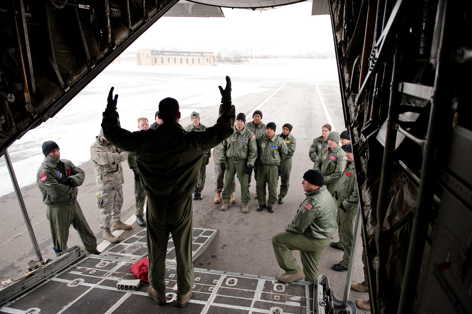 CINCINNATI, OHIO -- A loadmaster from the Kentucky Air Guard's 165th Airlift Squadron gives a pre-flight safety briefing at Lunken Airport here Feb 11, 2010, just prior to an aeromedical training sortie. The mission, which will take place in the skies over southern Ohio, is the capstone experience for six Air Force medical personnel participating in a two-week Critical Care Air Transport Team training course. Ground training and simulated-flight training are conducted at the University of Cincinnati, one of four Air Force Centers for Sustainment of Trauma and Readiness Skills (CSTARS) nationwide, but the final day of instruction is provided during actual flight. The Kentucky Air Guard began providing C-130s to use as a CSTARS training platform in 2009. (U.S. Air Force by Maj. Dale Greer)