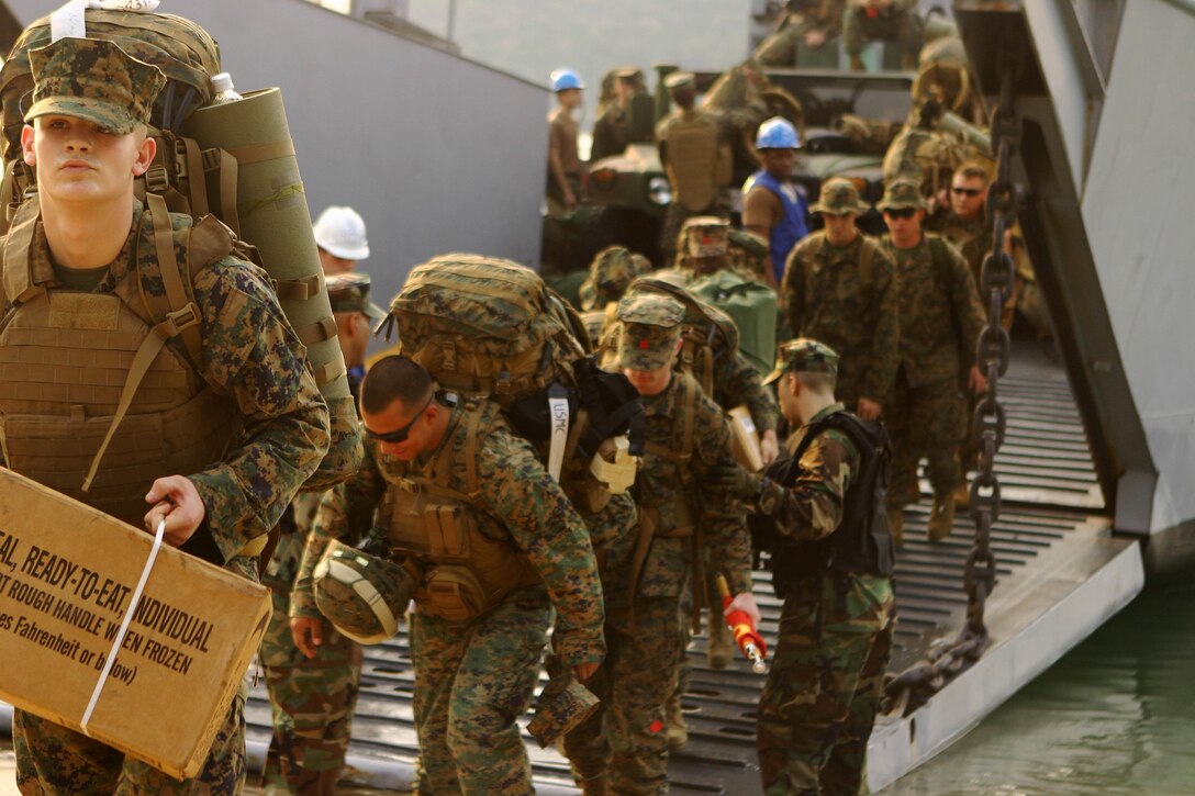 Marines with the 31st Marine Expeditionary Unit (MEU) disembark a landing craft utility (LCU) during the MEU’s offload phase in support of exercise Cobra Gold 2010 (CG ’10), Feb. 1. The exercise is the latest in a continuing series of exercises designed to promote regional peace and security.