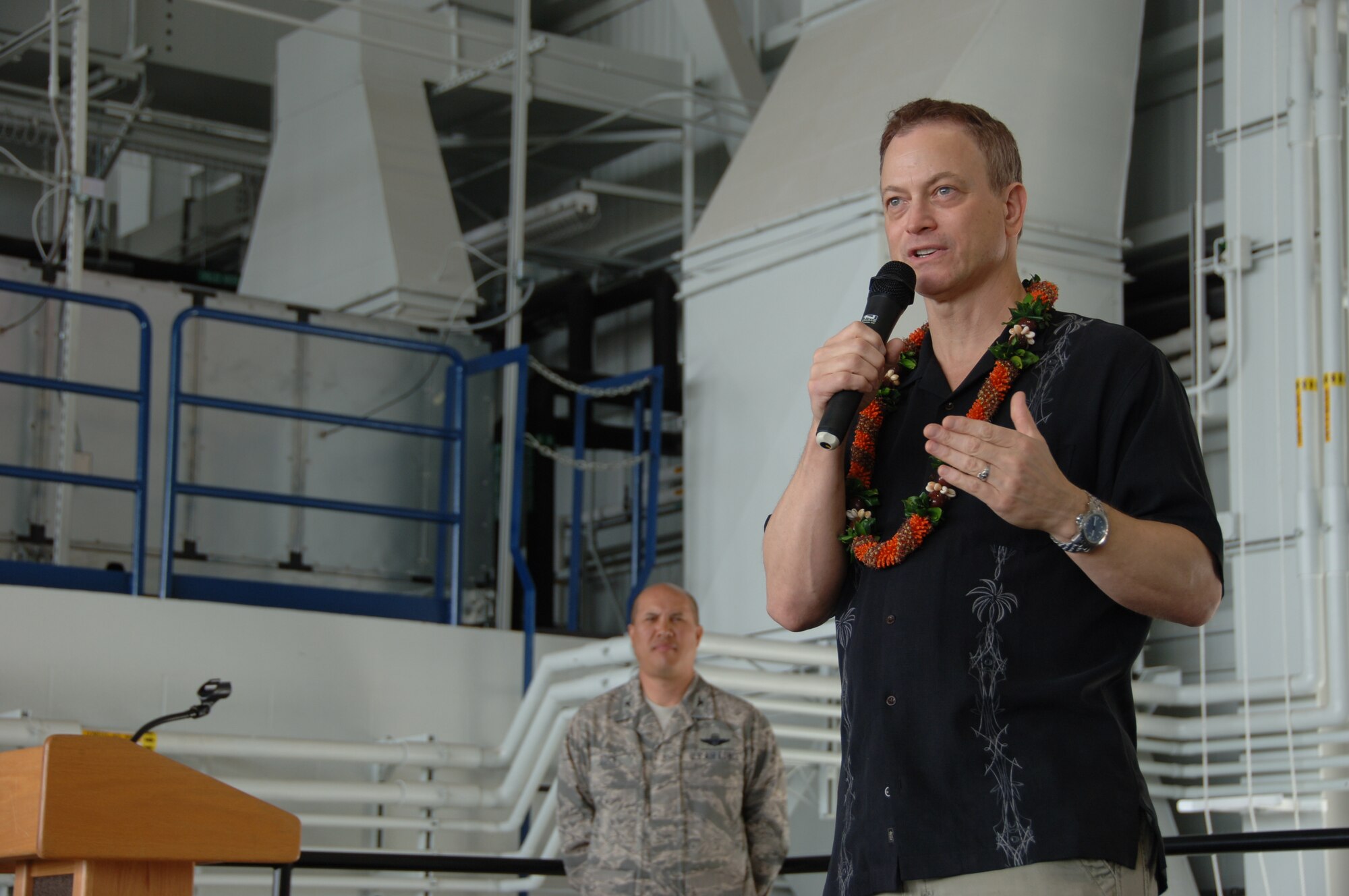 HICKAM AIR FORCE BASE, Hawaii - Gary Sinise, The Lt. Dan Band, speaks at a commander's call during Wingmans Day here, Jan. 29. After the commander’s call, a burger burn followed as airmen were treated to burgers and hot dogs, all support of Wingman Day. (U.S. Air Force photo by Senior Airman Nathaniel Allen)	