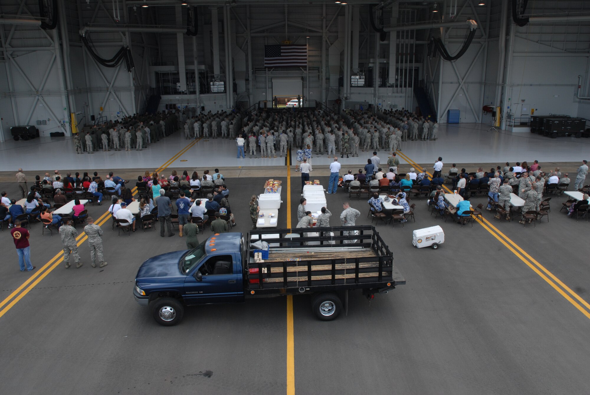 HICKAM AIR FORCE BASE, Hawaii - Air Force members stand in formation during a commander’s call that featured Gary Sinise, The Lt. Dan Band, and University of Hawaii coach Greg McMackin here, Jan. 29. After the commander’s call, a burger burn followed as airmen were treated to burgers and hot dogs, all support of Wingman Day. (U.S. Air Force photo by Senior Airman Gustavo Gonzalez)