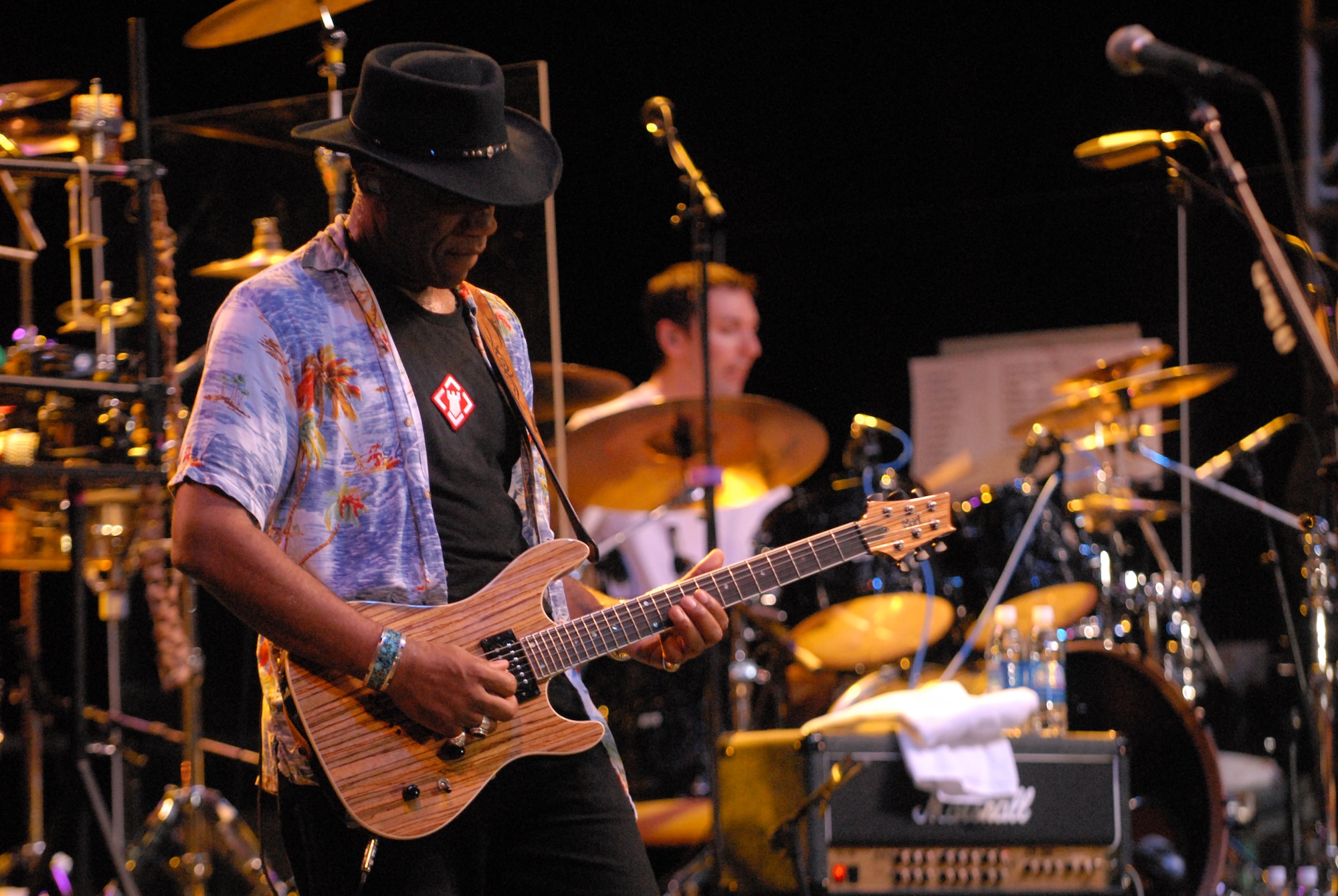 HICKAM AIR FORCE BASE, Hawaii - Kimo Williams, Lt. Dan Band guitarist and vocalist, plays the guitar during a performance here, Jan 30. Mr. Williams attended Leilehua High School in Wahiawa, Hawaii. The Lt. Dan Band performed songs from Bruce Springsteen, Linkin Park, to Aretha Franklin and Jimmy Hendrix. The Lt. Dan Band performs 30-40 shows per year, most of which are in support of the USO and other charities or benefits. (U.S. Air Force photo by Senior Airman Gustavo Gonzalez)