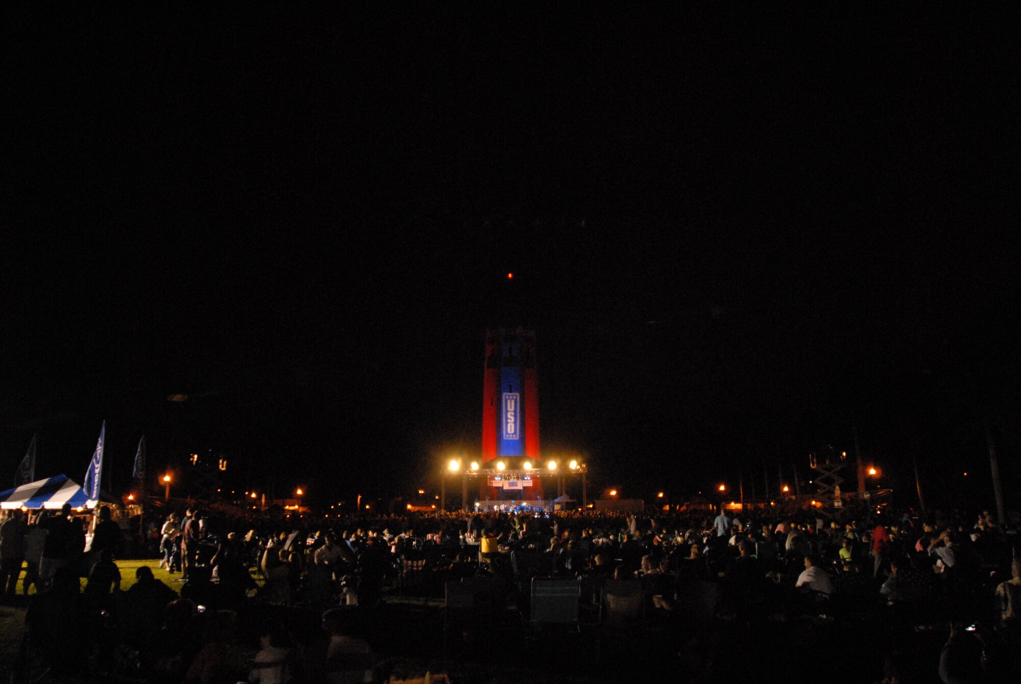 HICKAM AIR FORCE BASE, Hawaii - Air Force members and spouses watch the Lt. Dan Band concert here, Jan 30. The Lt. Dan Band played songs from Bruce Springsteen, Linkin Park, to Aretha Franklin and Jimmy Hendrix. The Lt. Dan Band performs 30-40 shows per year, most of which are in support of the USO and other charities or benefits. (U.S. Air Force photo by Senior Airman Gustavo Gonzalez)