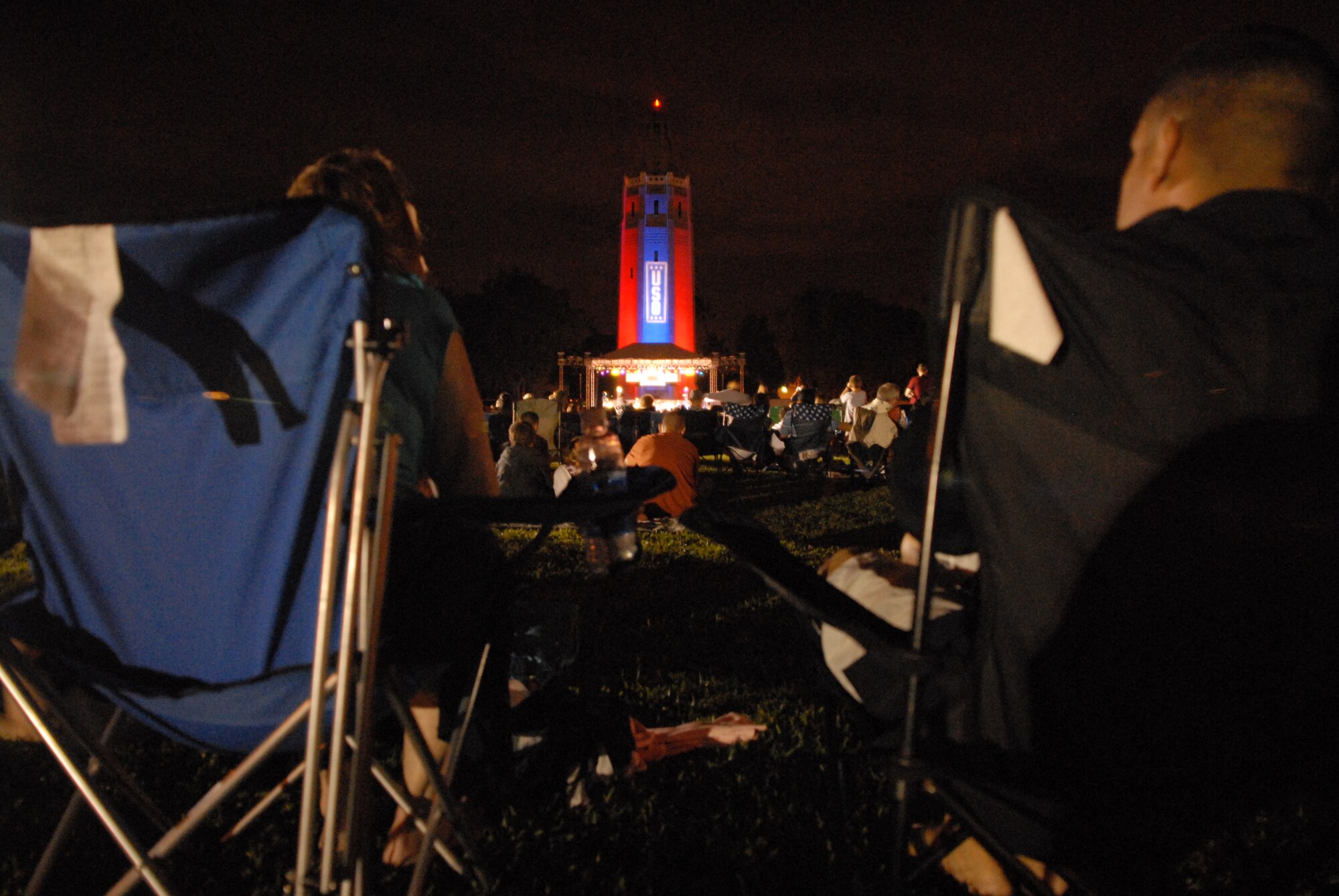 HICKAM AIR FORCE BASE, Hawaii - Air Force members and spouses watch the Lt. Dan Band concert here, Jan 30. The Lt. Dan Band played songs from Bruce Springsteen, Linkin Park, to Aretha Franklin and Jimmy Hendrix. The Lt. Dan Band performs 30-40 shows per year, most of which are in support of the USO and other charities or benefits. (U.S. Air Force photo by Senior Airman Gustavo Gonzalez)
