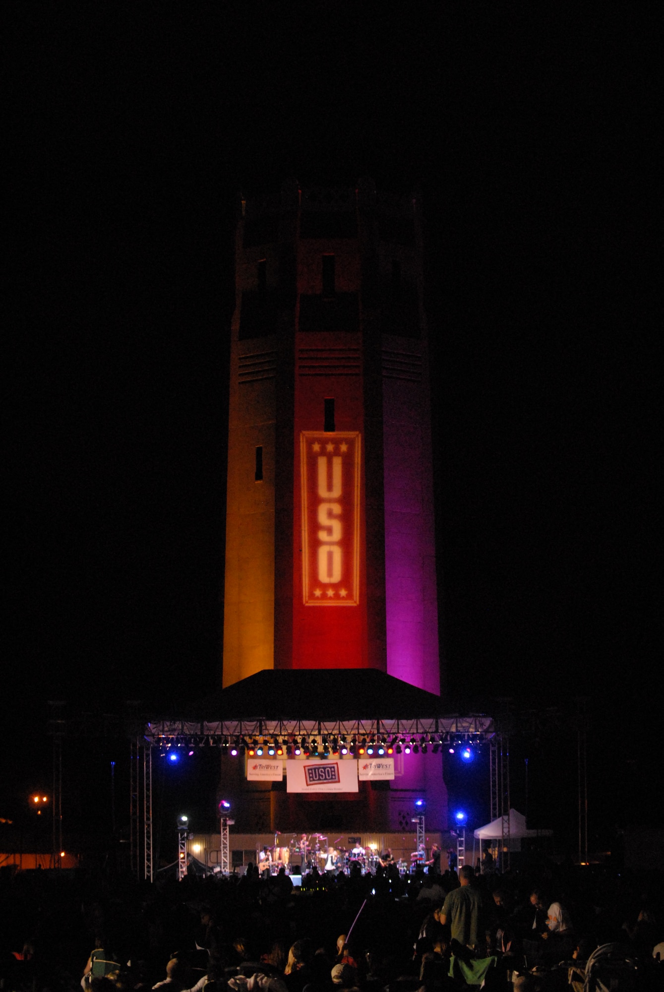 HICKAM AIR FORCE BASE, Hawaii - Air Force members and spouses watch the Lt. Dan Band concert here, Jan 30. The Lt. Dan Band played songs from Bruce Springsteen, Linkin Park, to Aretha Franklin and Jimmy Hendrix. The Lt. Dan Band performs 30-40 shows per year, most of which are in support of the USO and other charities or benefits. (U.S. Air Force photo by Senior Airman Gustavo Gonzalez)