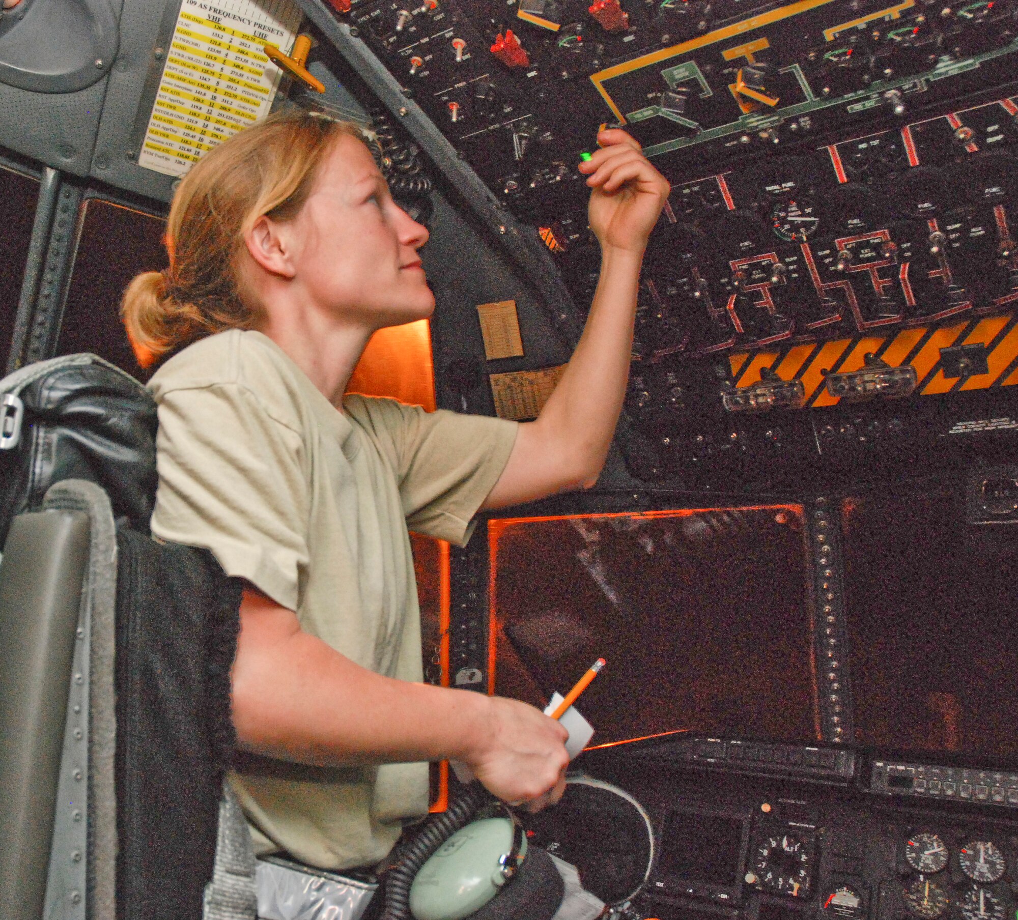 Staff Sgt. Brandilen Leary, 35th Expeditionary Airlift Squadron communications/navigation technician, assigned from  the 302nd Airlift Wing, Peterson AFB, Colo., switches off power to a Coronet Oak C-130 after completing the post flight radar and navigation systems check.    (U.S. Air Force photo/Master Sgt. Stan Coleman)