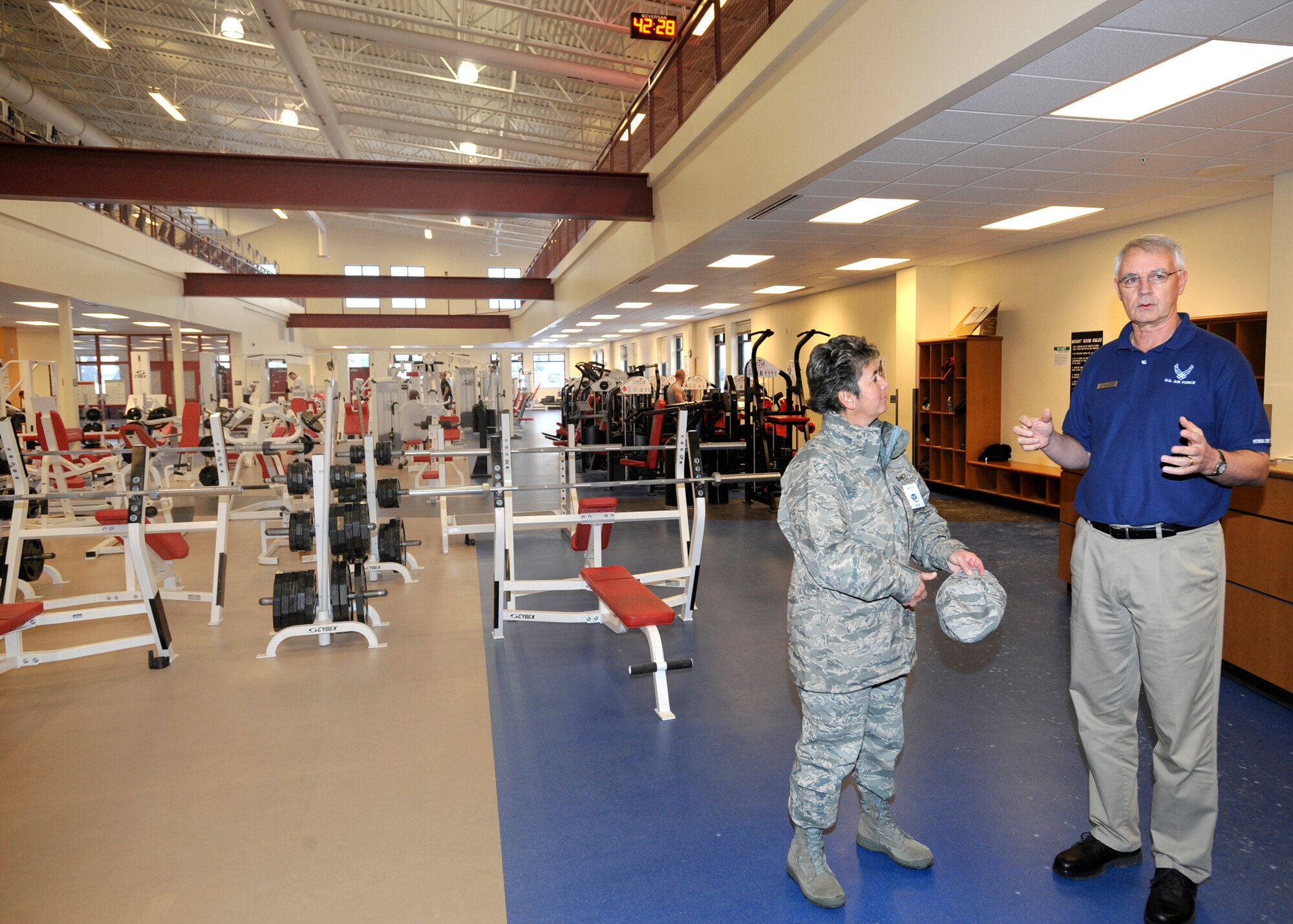 ELMENDORF AIR FORCE BASE, Alaska -- Mr. Tom  Lawson,  3rd Force Support Squadron,  shows  Maj. Gen. Anita Gallentine the first floor of the fitness center during the  Installation Excellence team’s  tour of the facility  Jan. 28. Maj. Gen. Gallentine and the Installation Excellence team were here to evaluate Elmendorf as one of two finalists for the Air Force Installation of the Year award. (Air Force photo by Senior Airman Matt Coleman-Foster)