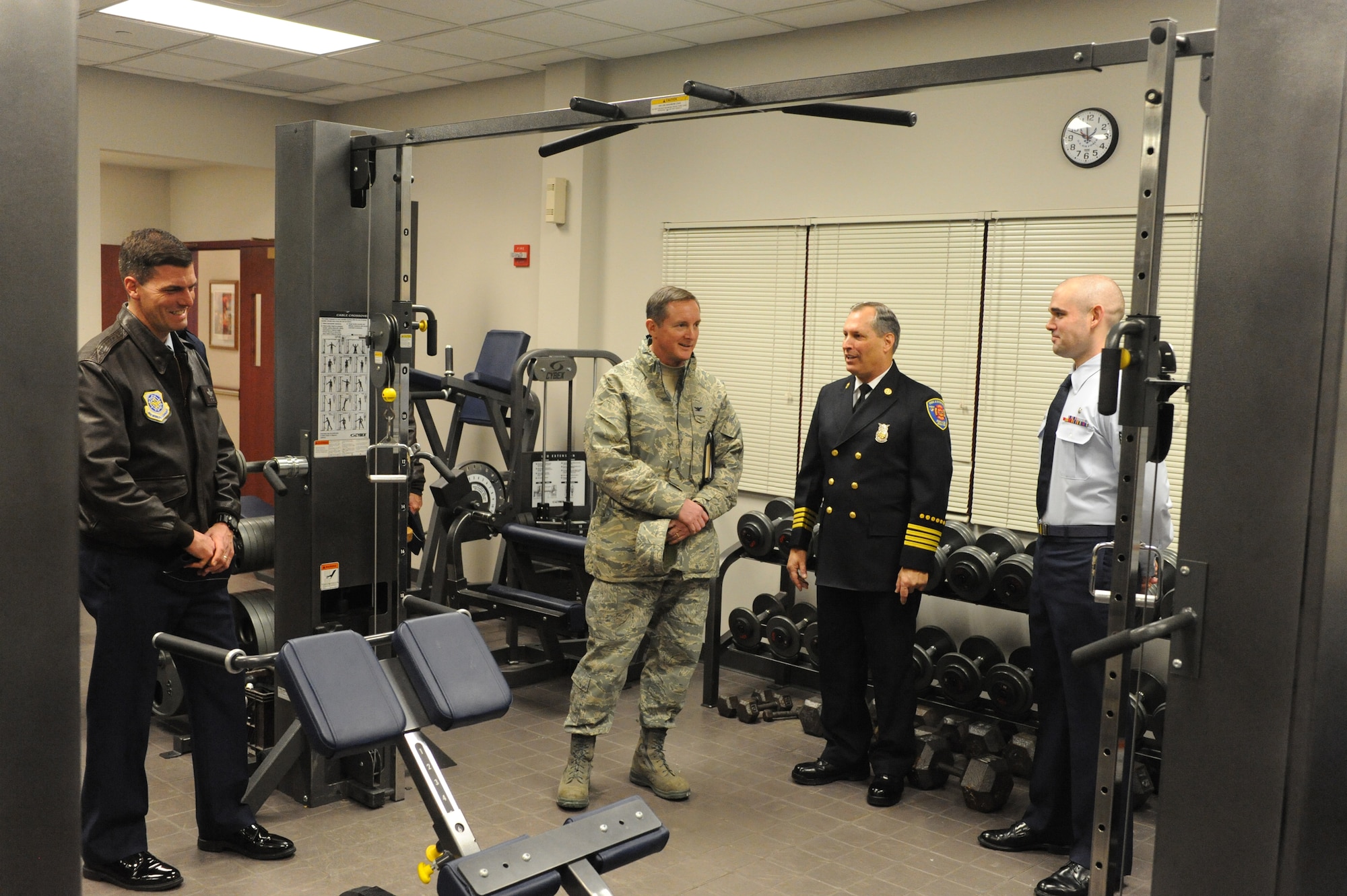 (From right)  Senior Airman Don Loristo, 436th Medical Operations Squadron, and Rodney Coleman, 436th Civil Engineer Squadron, brief Col. Stephen Clark, Installation Excellence Selection Board member, about the  collocated fire and emergency medical services at Dover AFB and other highlights of the fire station. Dover is one of two finalists for the 2010 Commander-in-Chief’s Annual Award for Installation Excellence. Elmendorf AFB, Alaska, is the other finalist for the award. (U.S. Air Force photo/Roland Balik)