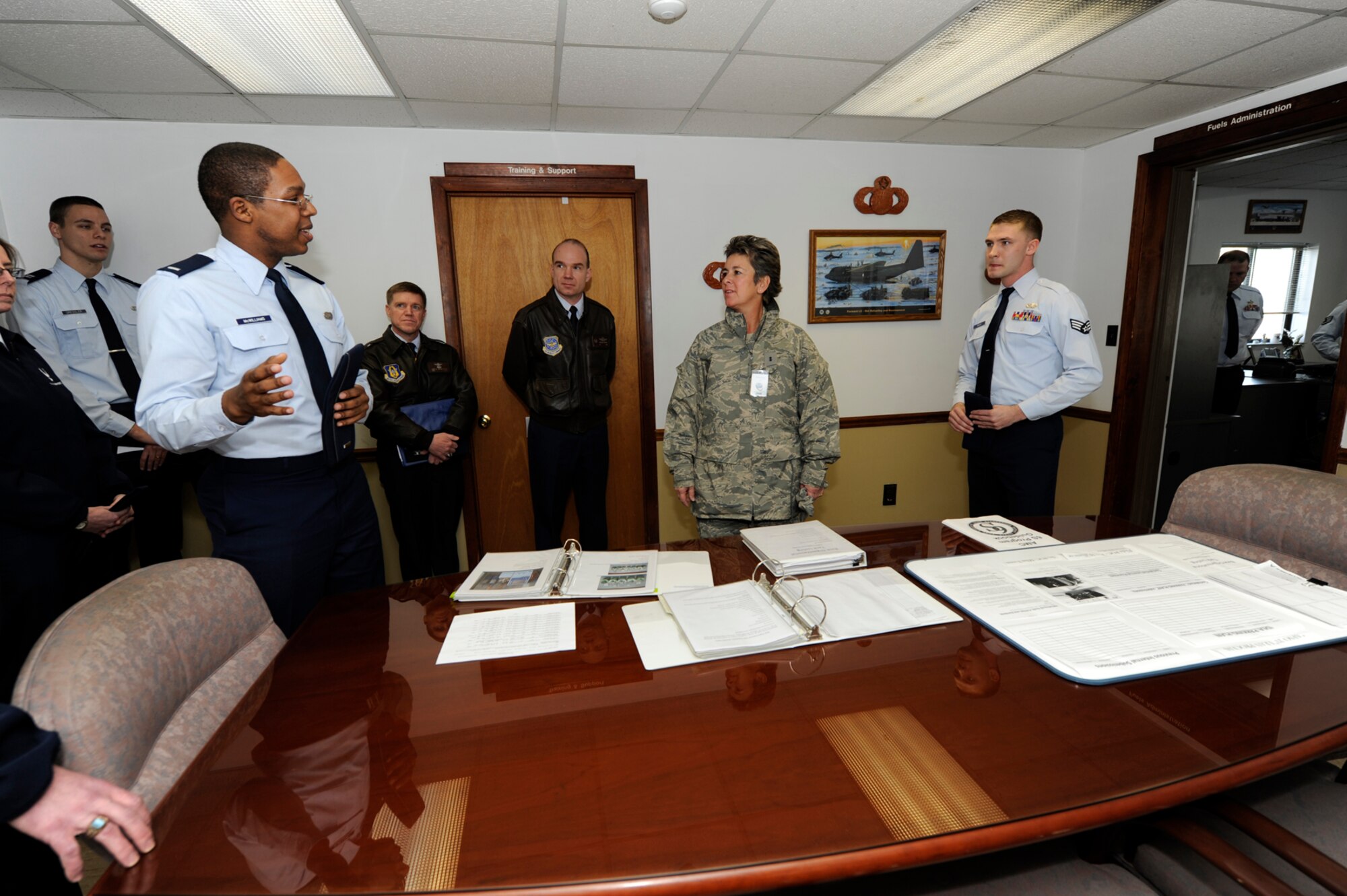 1st Lt. Marcus McWilliams, 436th Logistics Readiness Squadron, briefs Maj. Gen. Anita Gallentine, Air Force Installation Excellence Selection Board chief, about the new tank custodian training program. The training program will teach building custodians at Dover AFB the proper methods to maintain heating oil tanks. (U.S. Air Force photo/Jason Minto)