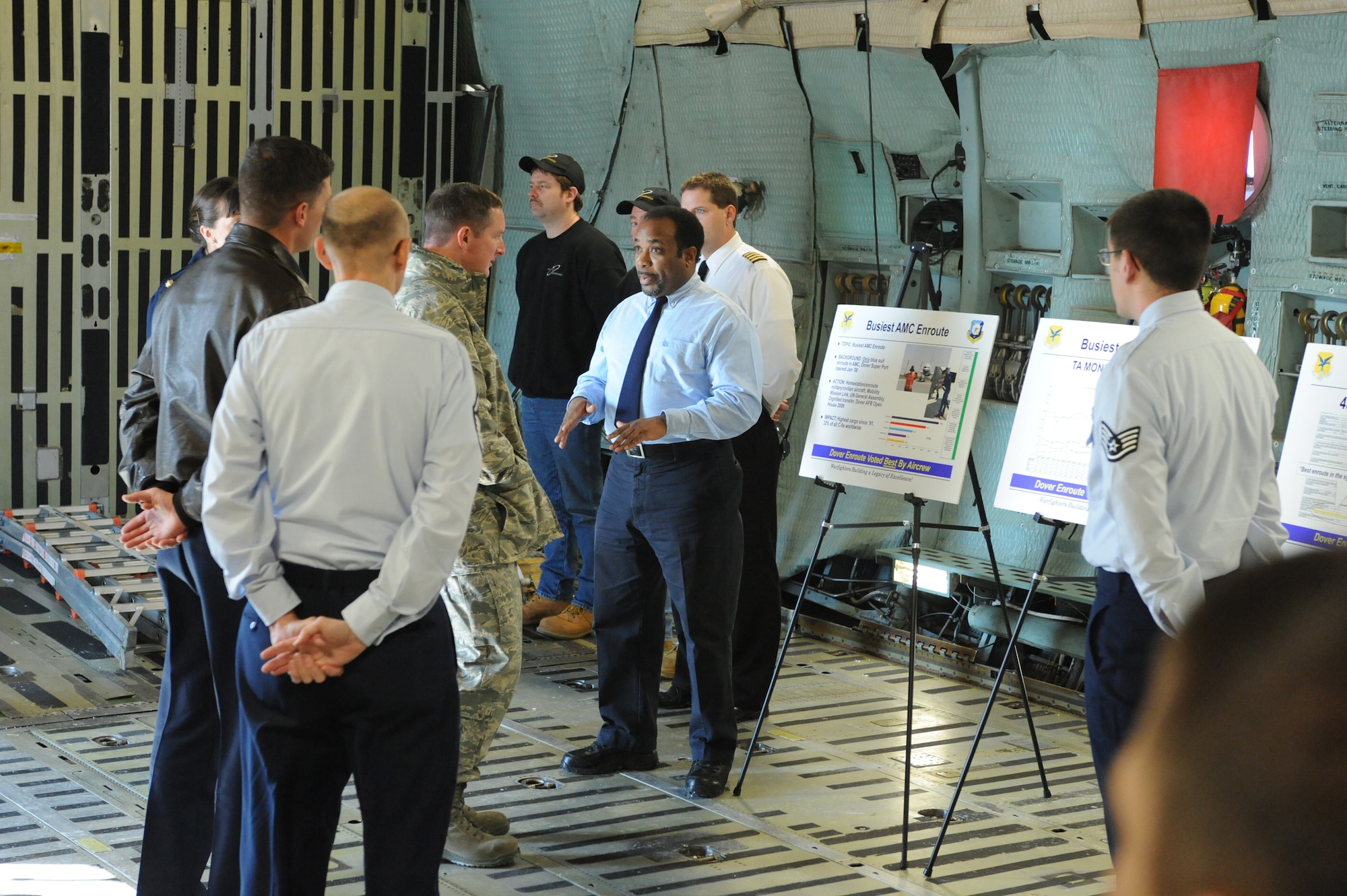 Charles Squash, 436th Aircraft Maintenance Squadron, briefs Col. Stephen Clark, Installation Excellence Selection Board member, about the transient maintenance flight at Dover Air Force Base. Dover’s transient maintenance flight serviced approximately 7,000 missions from Oct. 1, 2008-Sept. 30, 2009, and was voted best by visiting aircrews. Those 7,000 missions were responsible for moving approximately 138,000 tons of cargo and 8,000 passengers. The briefing is part of the IESB’s evaluation to determine whether Dover AFB should receive the 2010 Commander-in-Chief’s Annual Award for Installation Excellence. (U.S. Air Force photo/Roland Balik)