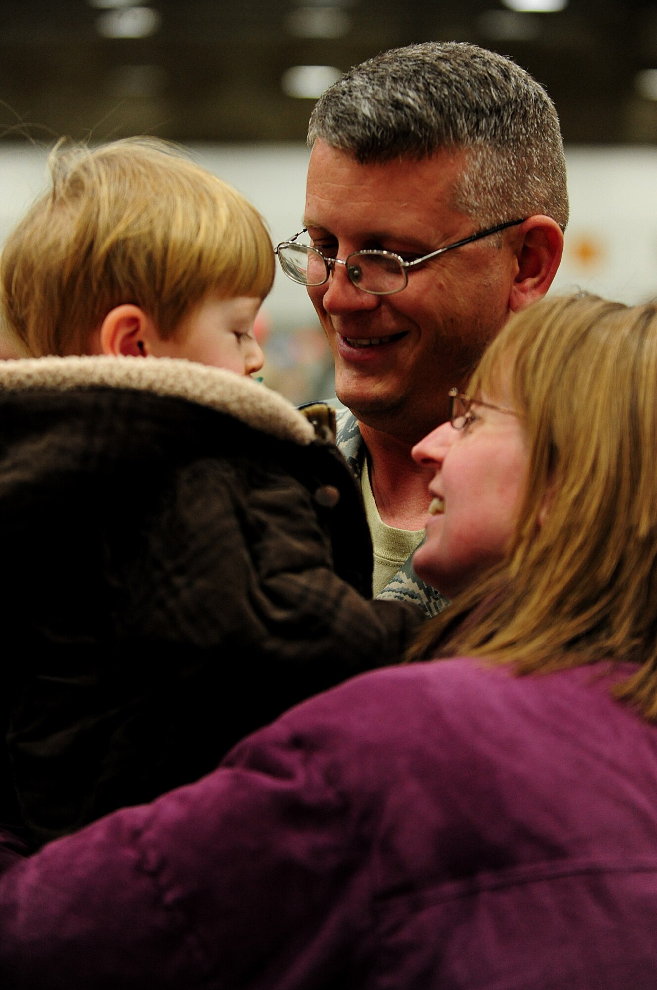 ELLSWORTH AIR FORCE BASE, S.D. --Master Sgt. Jeremy Owen, 28th Maintenance Squadron aircraft ground equipment team lead, spends time with his family after returning from his deployment to Southwest Asia, Jan. 29. Sergeant Owen provided support to Operations Iraqi Freedom and Enduring Freedom. (U.S. Air Force photo/Airman 1st Class Joshua J. Seybert)