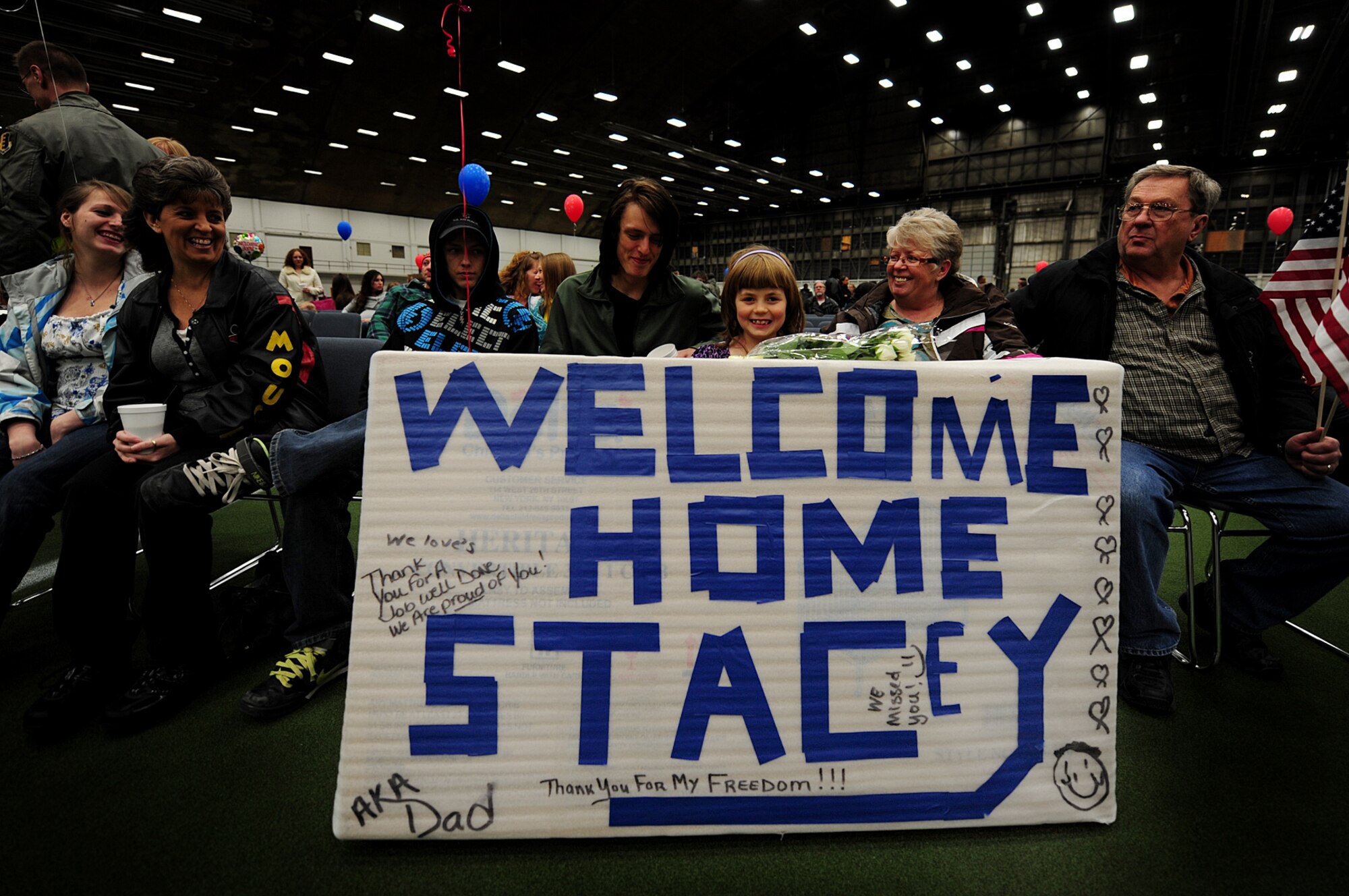 ELLSWORTH AIR FORCE BASE, S.D. --Family members of Tech. Sgt. Stacey Snyder, 28th Aircraft Maintenance Squadron consolidated tool kit NCO in charge, await his return from deployment to Southwest Asia, Jan. 29. Approximately 300 Airmen serving in various roles deployed to support Operations Iraqi and Enduring Freedom. (U.S. Air Force photo/Airman 1st Class Joshua J. Seybert)