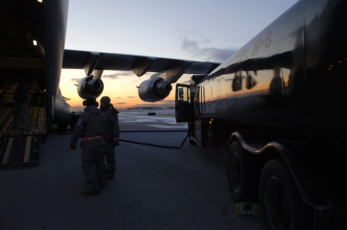 Airmen from the 179th Logistics Readiness Squadron refuel a McChord AFB, Wash., C-17 in Toledo, Ohio, Jan. 30. The C-17 took off from Charleston AFB and made a brief three-hour stop in Ohio. During that time, numerous pallets of supplies were loaded onto the C-17 for transport to Port-au-Prince, Haiti, in support of Operation Unified Response. (U.S. Air Force Photo/Airman 1st Class Lauren Main)
