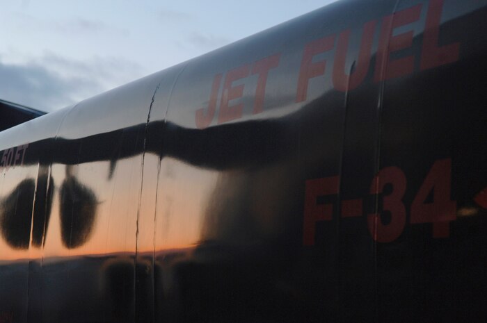 A fuel truck from the 179th Logistics Readiness Squadron is parked on the flightline in Toledo, Ohio, Jan. 30. The truck was utilized to fuel a McChord AFB, Wash., C-17 which took off from Charleston AFB and made a brief three-hour stop in Ohio. During that time, numerous pallets of supplies were loaded onto the C-17 for transport to Port-au-Prince, Haiti, in support of Operation Unified Response. (U.S. Air Force Photo/Airman 1st Class Lauren Main)
