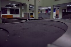 The empty baggage claim area at Aeroport International Toussaint Louverture in Port-au-Prince, Haiti, sits damaged and vacant. The airport terminal saw little traffic while a temporary four-day hold was placed on the transportation of evacuees out of Haiti. (U.S. Air Force Photo/Airman 1st Class Lauren Main)