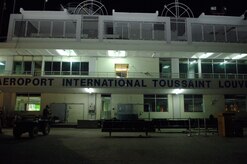 The vacant airport in Port-au-Prince, Haiti, is lit by a few exterior lights. During the day, the area is regularly filled with those waiting to board aircraft for evacuation to the U.S. (U.S. Air Force Photo/Airman 1st Class Lauren Main)