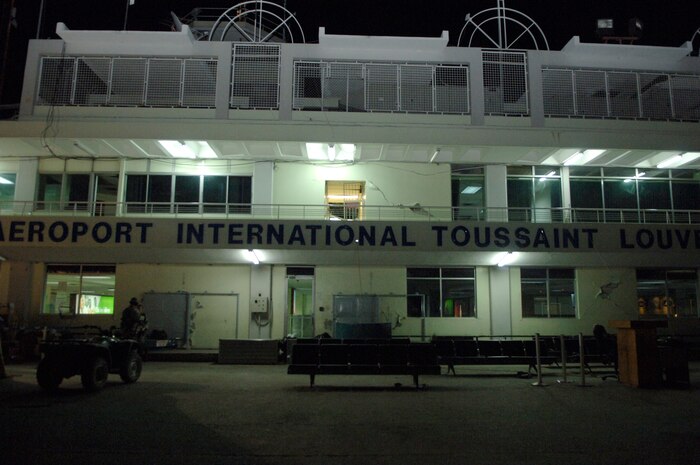 The vacant airport in Port-au-Prince, Haiti, is lit by a few exterior lights. During the day, the area is regularly filled with those waiting to board aircraft for evacuation to the U.S. (U.S. Air Force Photo/Airman 1st Class Lauren Main)