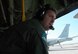 Tech. Sgt. Barry Burkitt, an Air Force Reserve C-130 loadmaster, looks on as supplies as United Nations helicopter fly overhead Jan. 30 at Toussaint Louverture International Airport in Port-au-Prince, Haiti. Also providing aid is a KC-135 from the Brazilian air force, parked just behind Sergeant Burkitt and his C-130 Hercules. Sergeant Burkitt is one of approximately 50 Airmen from the 302nd Airlift Wing currently assigned to the 35th Expeditionary Airlift Squadron, which supports Air Expeditionary Force Coronet Oak at Muniz Air Base, Puerto Rico. The members are deployed in support of Haiti earthquake relief operations. (U.S. Air Force photo/Staff Sgt. Stephen J. Collier)
