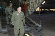 Lt. Col. David Rodberg and Tech. Sgt. Alycia Jackson offload medical equipment they used to provide critical assistance to Haitians Jan. 31, 2010, at Dobbins Air Reserve Base, Ga. The crew returned from a two-week deployment in support of Operation Unified Response. Colonel Rodberg is the 94th Aeromedical Evacuation Squadron medical crew director and Sergeant Jackson is a 94th AES medical technician. (U.S. Air Force photo/Don Peek)