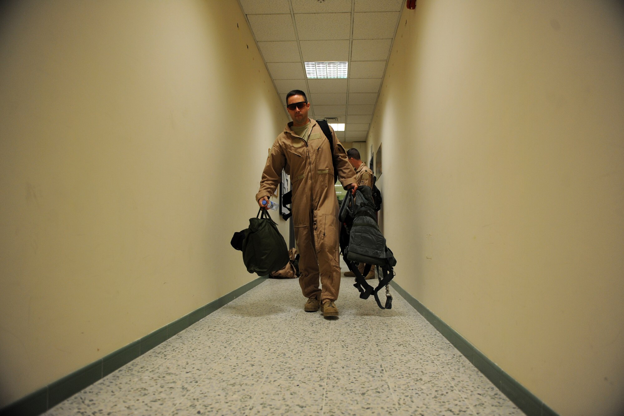 Maj. Nathan Rowan heads to a crew bus to be transported to a B-1B bomber for the last mission of his six-month deployment Jan. 23, 2010, at an air base in Southwest Asia. Major Rowan is a B-1B Lancer pilot assigned to the 37th Expeditionary Bomb Squadron. (U.S. Air Force photo/Staff Sgt. Manuel J. Martinez)