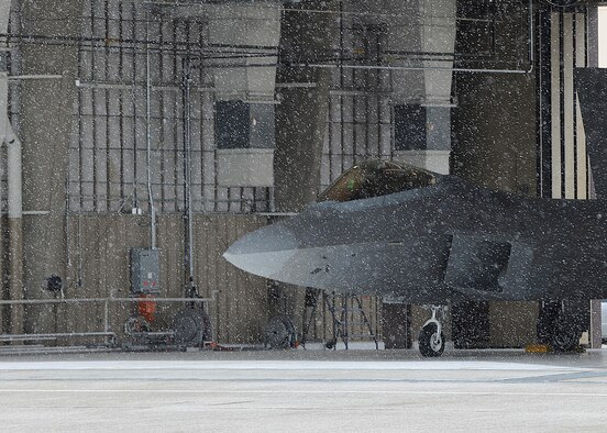 HOLLOMAN AIR FORCE BASE, N.M. -- An F-22A Raptor bearing the ‘HO’ tail markings awaits clearance from Team Santa at the North Pole during “Operation Assist Santa” last year. Members of Team Holloman assist the jolly old elf as he makes his way through New Mexico on Christmas Eve. The F-22 will serve as an escort, or wingman, while the MQ-1 Predator and MQ-9 Reaper will provide Santa with “special intelligence” through naughty and nice sensors and sleep detectors installed on the two aircraft. The remotely piloted aircraft will also ensure Santa has safe landing zones in the Tularosa Basin and Sacramento Mountain areas. (U.S. Air Force photo by Senior Airman John D. Strong II / Released)