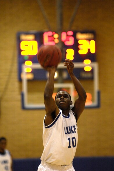 Luke team member Senior Airman Charles DeJohnette, 56th Equipment Maintenance Squadron aircrew ground equipment apprentice, prepares to shoot the ball during the Varsity Basketball Game against Davis-Monthan at Luke Air Force Base, Ariz, Jan 30, 2009. (U.S. Air Force Photo by Staff Sgt. Jason Colbert)