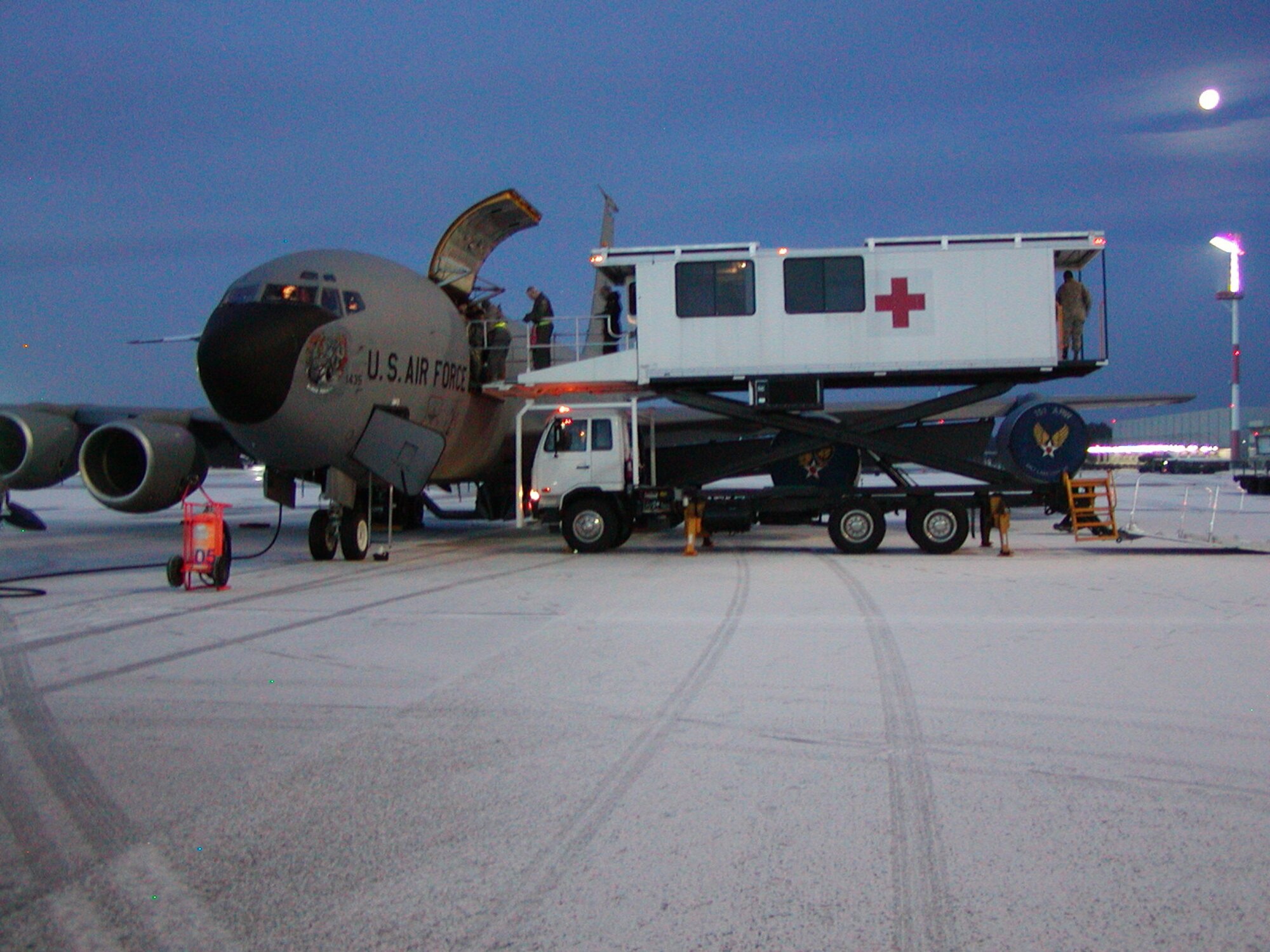 A specialized medical K-Loader prepares to offload patients who have been recently flown in a Utah Air National Guard KC-135 from Bagram Air Base, Afghanistan to Ramstein AB, Germany. Once medical ground crews offload the patients, they will be transported to the Landstuhl Regional Medical Center for further medical treatment. U.S. Air Force photo by Maj. Dan Boyack. (Unclassified)