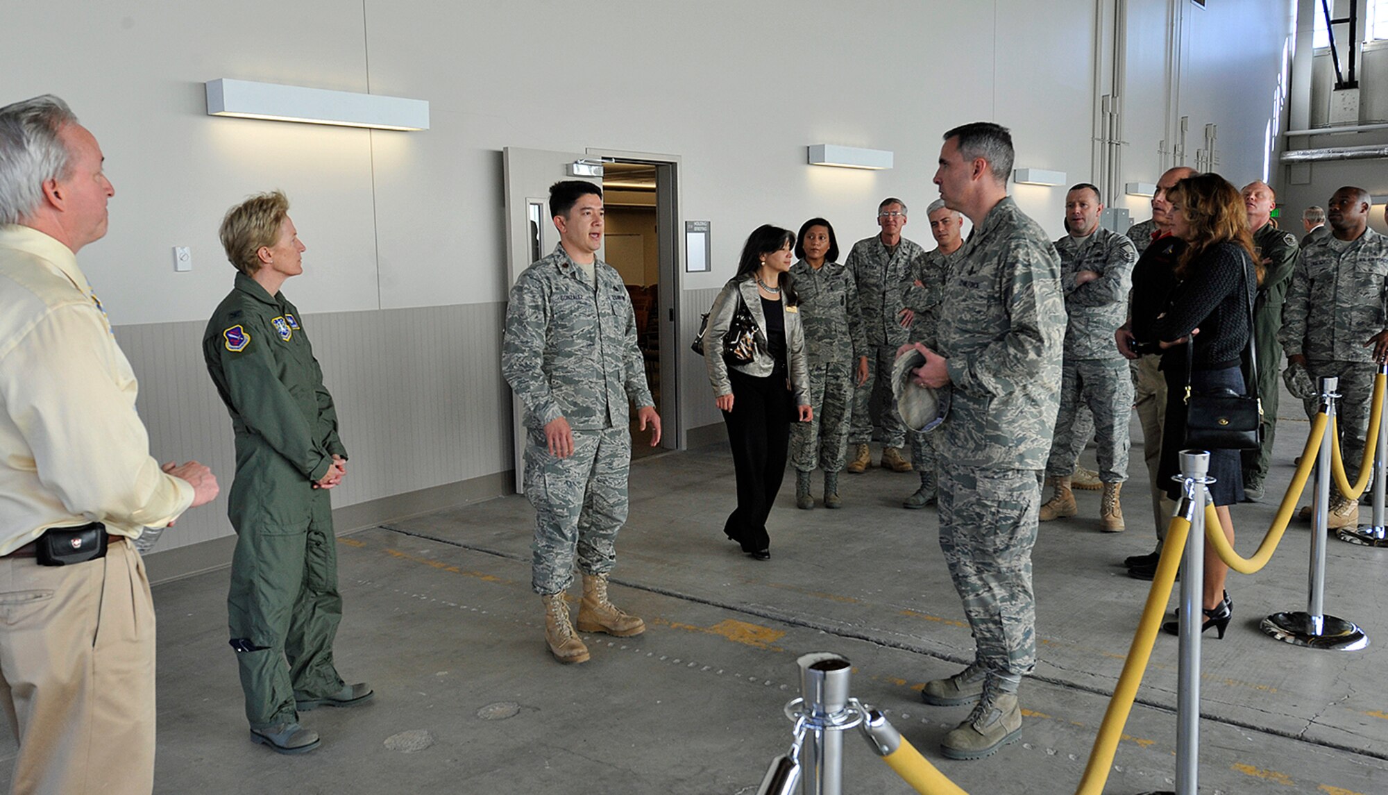 Col. Stephen N. Whiting (right), 21st Space Wing commander, discusses the importance of proper deployment facilities in today’s dynamic Air Force with Maj. Jerry Gonzalez, 21st Logistics Readiness Squadron commander, at the 21st LRS building’s grand re-opening Jan. 22 at Peterson Air Force Base. The $3.4 million renovation features a new training classroom, deployment processing line with enough space for all the required agencies, and a holding area that can accommodate 180 deployers. (Air Force photo by Rob Bussard)