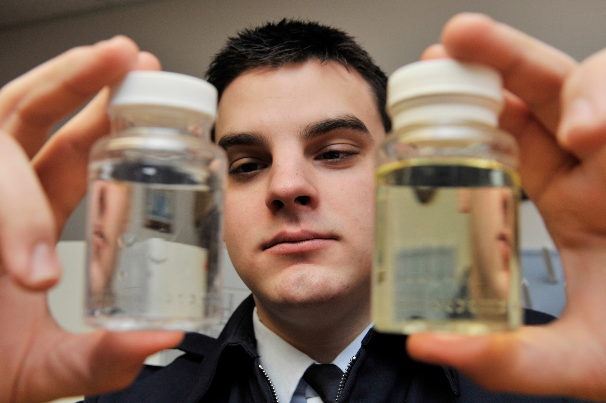 Airman 1st Class Samuel Bergh compares water samples Feb. 1, 2010, Eielson Air Force Base, Alaska. Airman Bergh is bioenvironmental technician assigned to the 354th Medical Operations Squadron. (U.S. Air Force photo/Staff Sgt. Christopher Boitz)