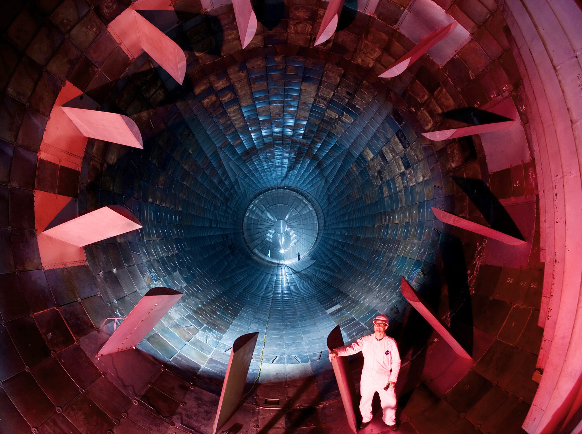 Inside the diffuser section of the16-foot supersonic wind tunnel at Arnold Air Force Base, Tenn., Dr. Richard Roberts checks out the turbine blades during a site visit Oct. 6, 2009. Dr. Roberts is the project manager of the von Karman Gas Dynamics Facility and the Propulsion Wind Tunnel Facility located at Arnold Engineering Development Center on Arnold AFB. (U.S. Air Force photo/Lance Cheung)