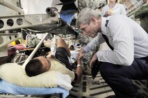 Air Force Chief of Staff Gen. Norton A. Schwartz talks with Senior Airman Bren Mejia during an aeromedical evacuation mission Aug. 7, 2009, on the Andrews Air Force Base, Md., flightline. The 779th Medical Group at Andrews has the busiest aeromedical staging facility in the continental United States, caring for more than 100 wounded and ill warriors returning each week. (U.S. Air Force photo/Staff Sgt. Renae L. Kleckner)