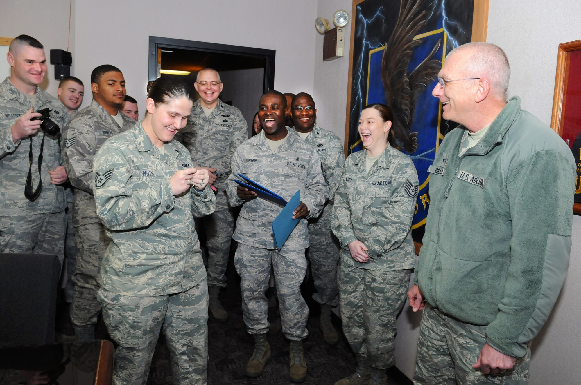 Staff Sgt. Lisa Muth, 72nd Security Forces Squadron, was surprised by Maj. Gen. David Gillett Jan. 22 with a Stripes for Exceptional Performance promotion. General Gillett, the Oklahoma City Air Logistics Center commander, promoted Sergeant Muth from staff sergeant to technical sergeant. Col. Allen Jamerson, 72nd Air Base Wing commander, Col. Herbert Wesselman, 72nd Mission Support Group commander, and 72nd Air Base Wing Command Chief Master Sergeant Eric Harmon were also present for the surprise. There are a limited number of STEP promotions given out Air Force-wide each year. (Air Force photo by Dave Faytinger)