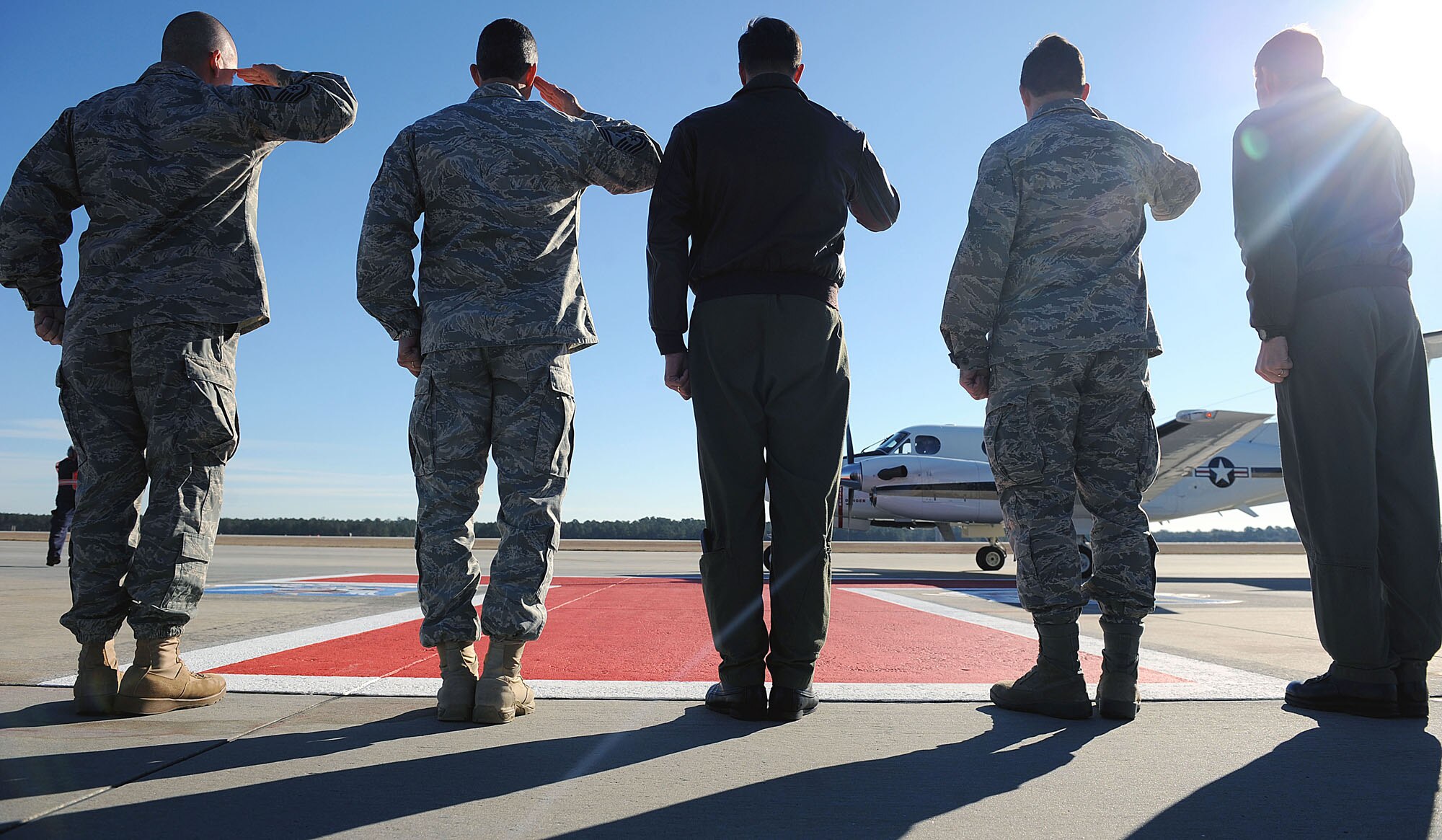 MOODY AIR FORCE BASE, Ga. -- Moody leadership salute the aircraft transporting Gen. William M. Fraser III, Air Combat Command commander, as he arrives during his base visit here Jan. 27. General Fraser toured Moody to get a firsthand look at various agencies and also met with Airmen under his command. (U.S. Air Force photo by Airman 1st Class Joshua Green) 