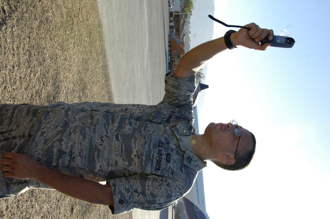 Captain Dan Santiago, Joint Special Operations Air Component weather officer, uses his Kestral pocket weather sensor at the Toussaint L'Ouverture International Airport in Port au Prince, Haiti. Capt. Santiago deployed as part of the Air Force Special Operations Contingent responsible for opening and establishing aircraft flow following the 7.1 magnitude earthquake that struck here Jan. 12. Capt. Santiago and fellow 1st Special Operations Wing weather flight weatherman Tech. Sgt. Chris Patterson employed creative solutions to overcome technological and equipment shortfalls during their deployment to Haiti. (U.S. Air Force photo by Tech. Sgt. Larry Carpenter)  
