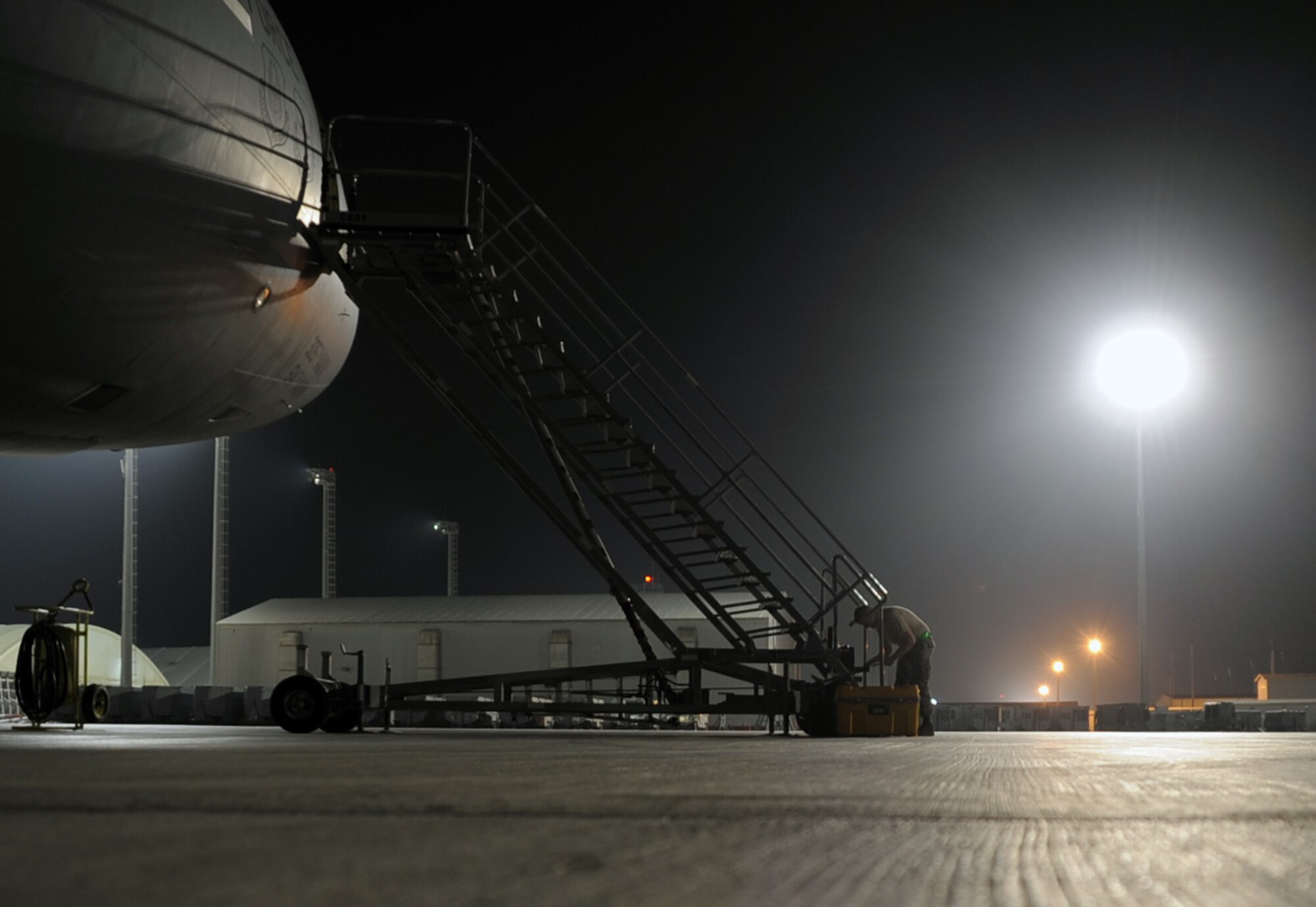 Airman 1st Class Garret Coleman, a KC-10 Extender maintenance Airman with the 380th Expeditionary Aircraft Maintenance Squadron, looks through a toolbox while working on the flightline at a non-disclosed base in Southwest Asia on Jan. 31, 2010.  Airman Coleman is deployed from the 605th Aircraft Maintenance Squadron at Joint Base McGuire-Dix-Lakehurst, N.J., and his hometown is Springfield, Mo.  (U.S. Air Force Photo/Master Sgt. Scott T. Sturkol/Released)