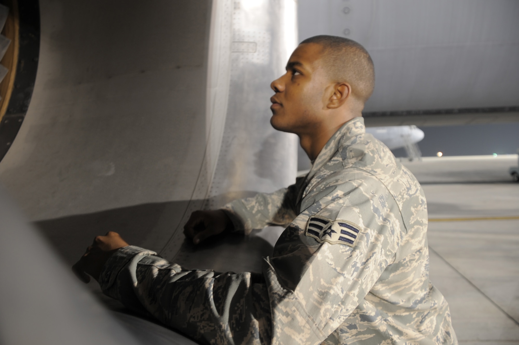 Senior Airman Justin Lassiter, KC-10 Extender aerospace propulsion journeyman deployed with the 380th Expeditionary Aircraft Maintenance Squadron, looks over the engine of a KC-10 at a non-disclosed base in Southwest Asia. His primary mission is to fix and maintain KC-10 aircraft engines and systems. He is on his third deployment with the 380th EAMXS. Airman Lassiter is deployed from the 605th Aircraft Maintenance Squadron at Joint Base McGuire-Dix-Lakehurst, N.J., and his hometown is Wilson, N.C. (U.S. Air Force Photo/Master Sgt. Scott T. Sturkol/Released)